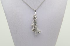 Diamond Cascade Gold Swirl Pendant