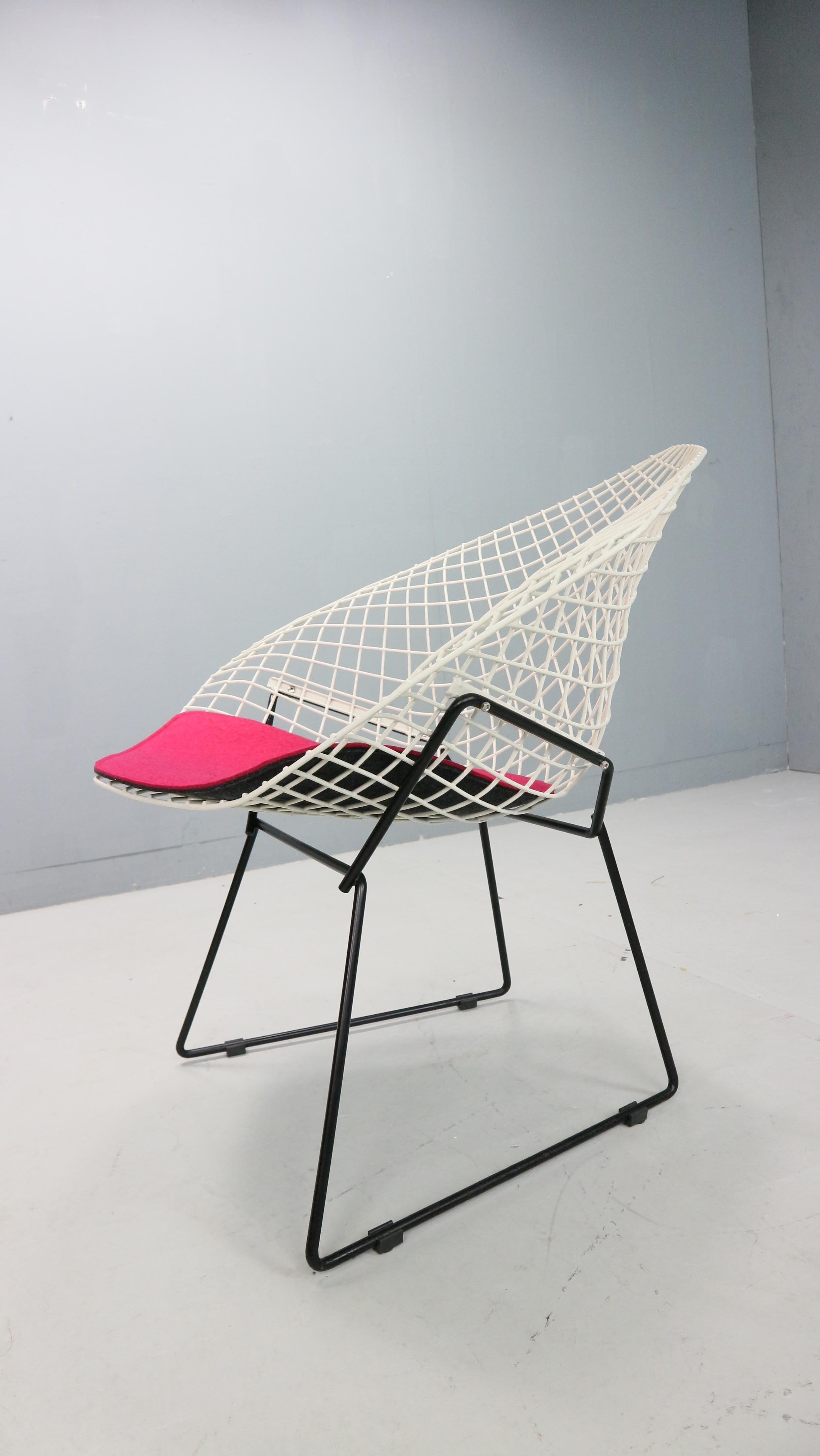 An old and original Diamond Chair, designed by Harry Bertoia. U.S.A., Knoll International, 1960s

The Bertoia Diamond Armchair, originally designed in 1952 is one of the most iconic designs by Harry Bertoia, who was not only a furniture designer but