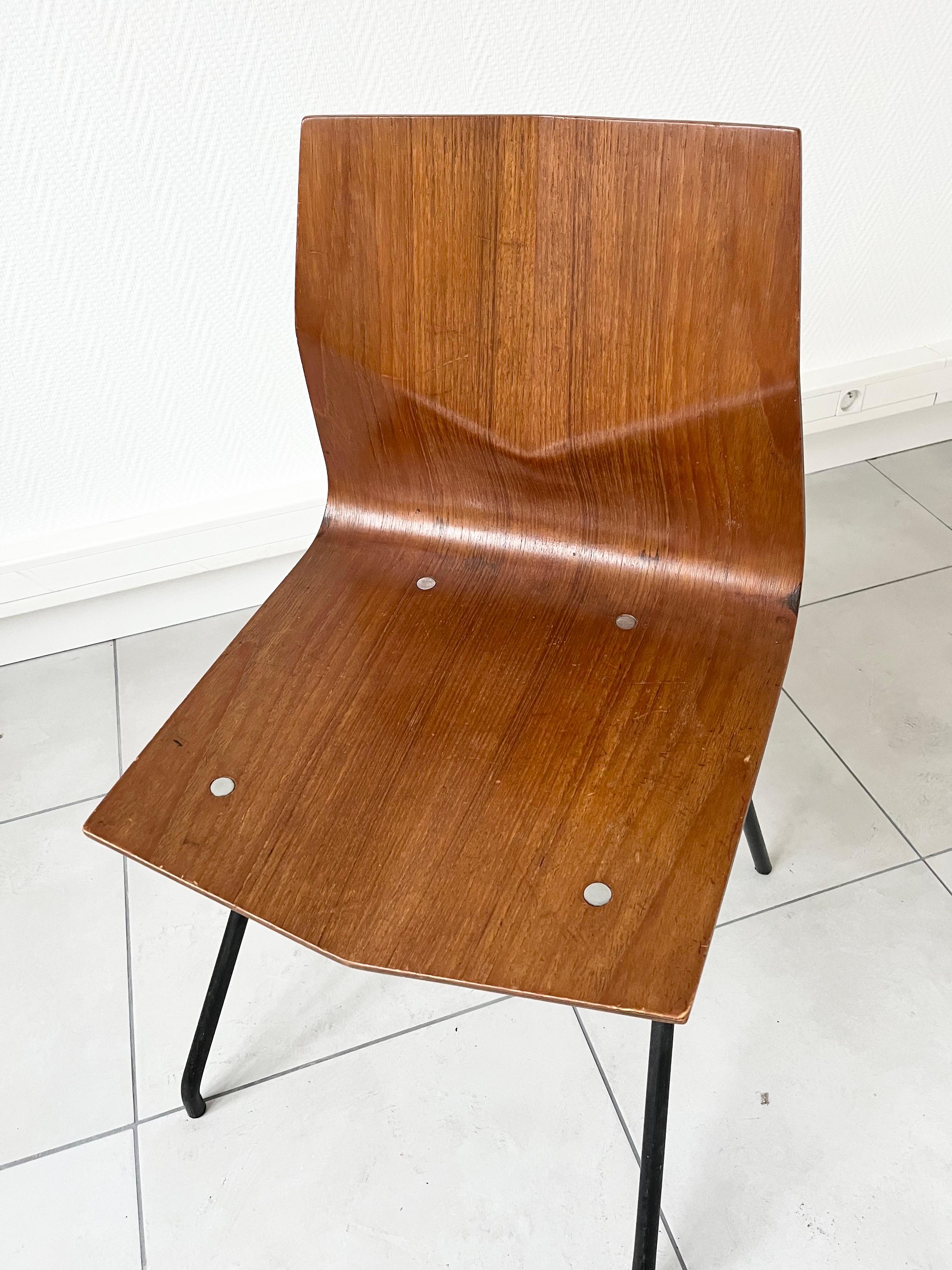 Diamond chair in teak and black leather, by René—Jean Caillette for Steiner, France circa 1958.