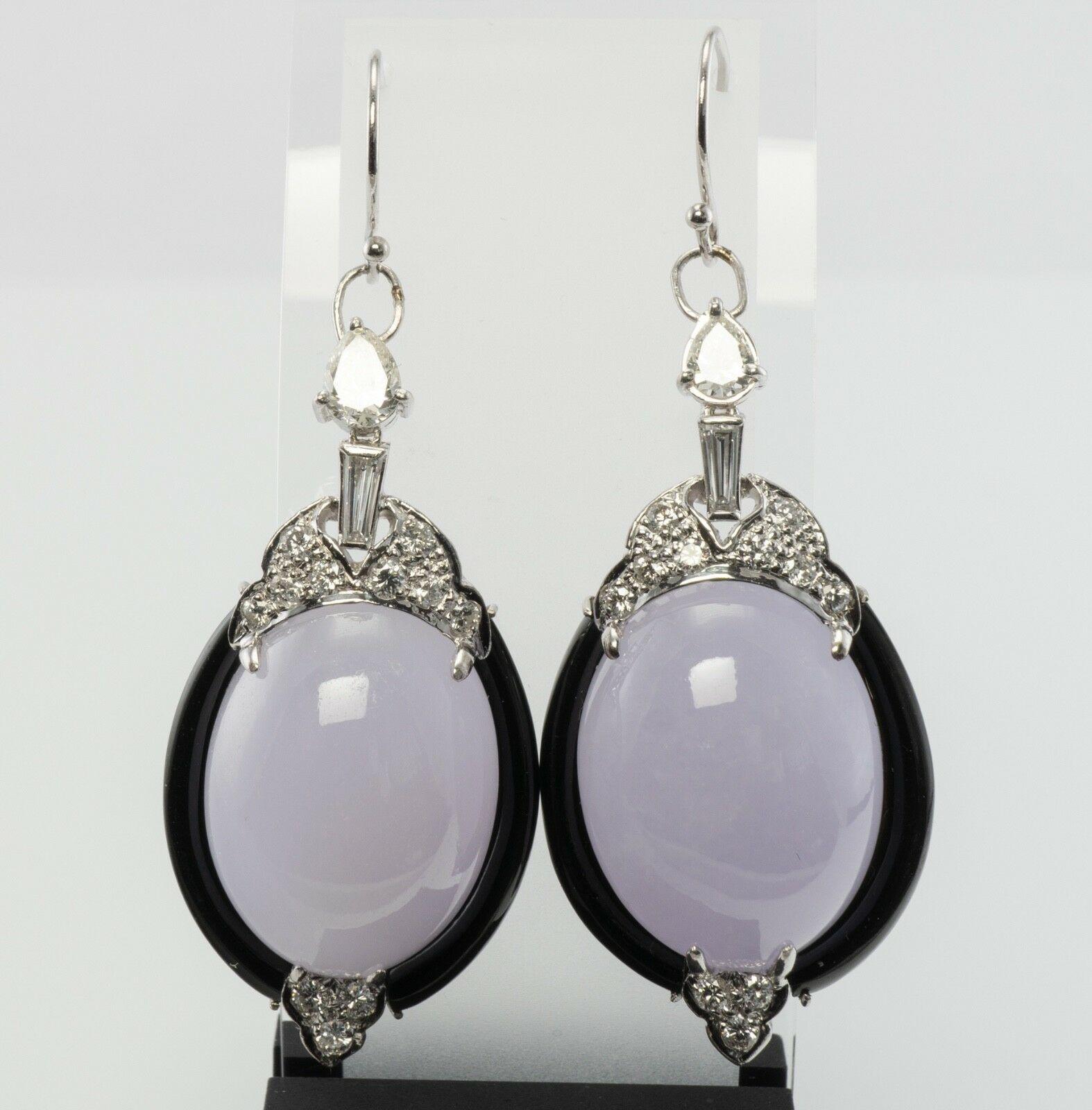 These gorgeous estate earrings are finely crafted in solid 14K White gold and set with genuine Chalcedony, Black Onyx, and diamonds. Each Chalcedony cabochon measures 21mm x 16mm. These gems have a pale purple color. Stunning stones! Black onyx