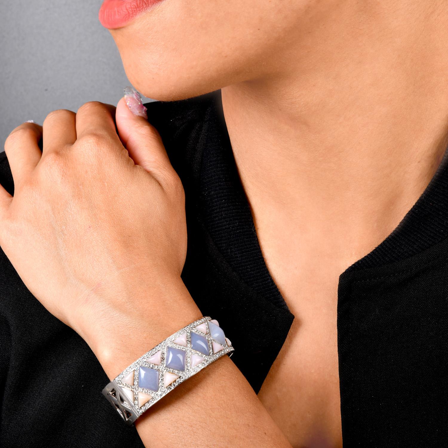 This estate checker Design Heavy 18K Gold Cuff Bangle Bracelet is crafted in 18k white gold weighing approximately 54.8 grams.

Expertly crafted in solid 18K white gold, featuring natural Genuine dazzlings Diamonds round-cut, weighing approx. 5.90