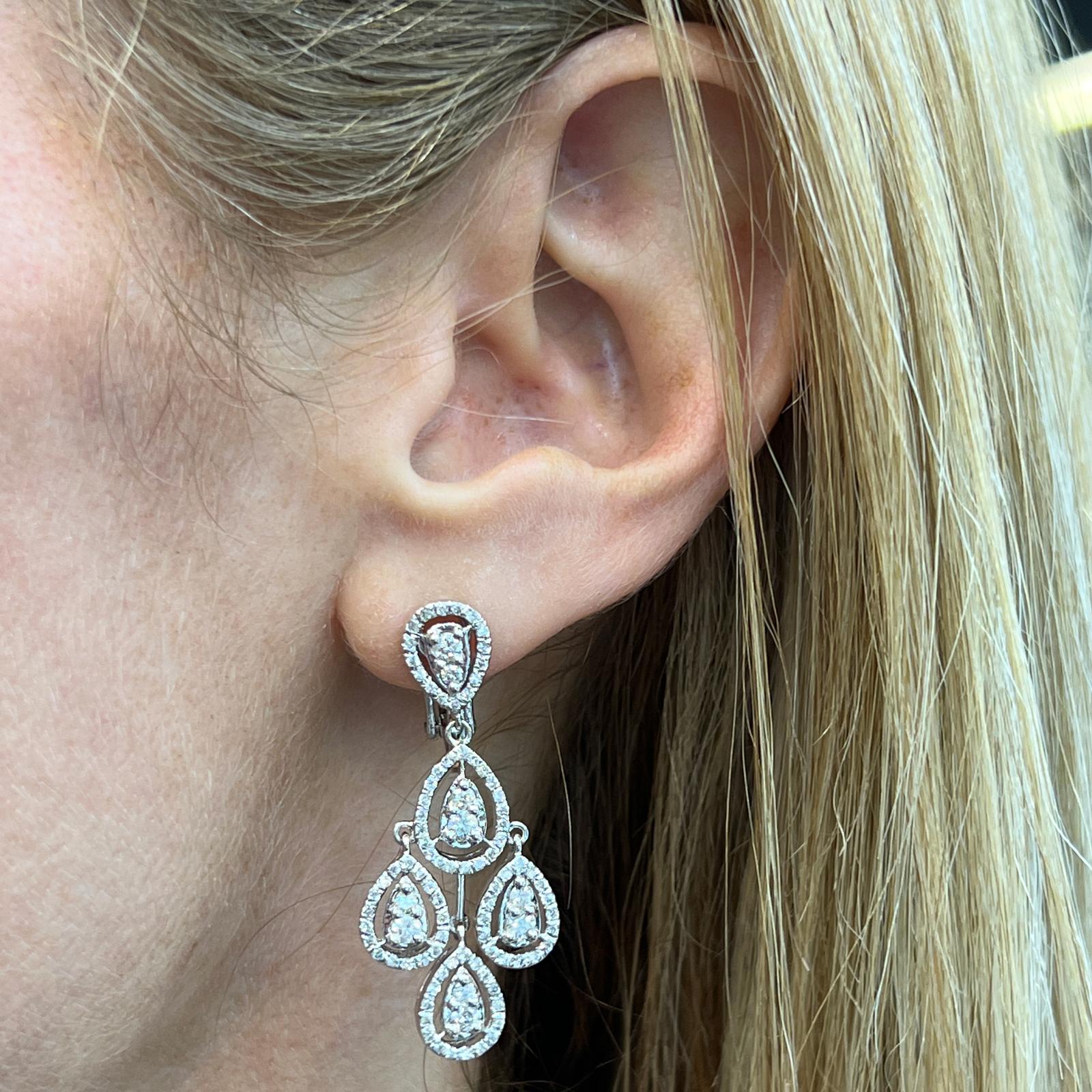 Gorgeous diamond chandelier dangle earrings fashioned in 18 karat white gold. The earrings feature 192 round brilliant cut diamonds weighing approximately  2.00 CTW and graded H-I color and SI clarity. The earrings measure 1.50 inches in length with
