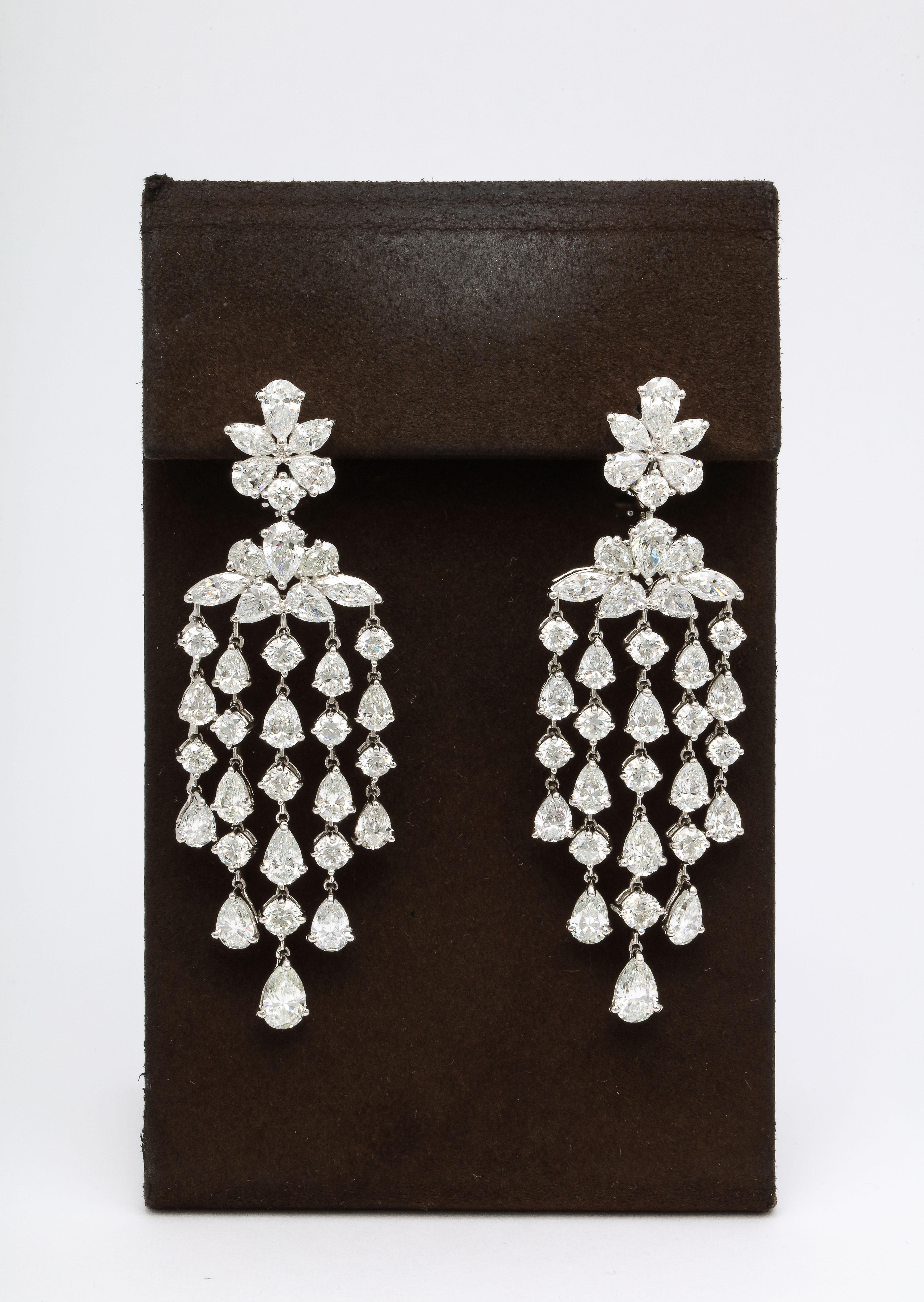 
A beautiful earring with tons of sparkle and movement. 

25.42 carats of white round, pear and marquise shaped diamonds set in platinum. 

2.85 inches long 

