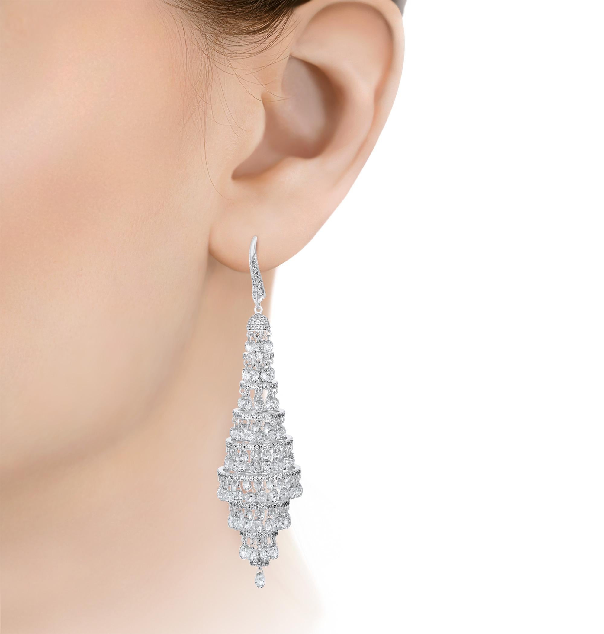 Exuding timeless luxury, this radiant pair of chandelier earrings features an impressive array of briolette-cut diamonds totaling 25.72 carats. The dazzling stones artfully cascade in a lustrous 18K white gold setting. Sophisticated and elegant,