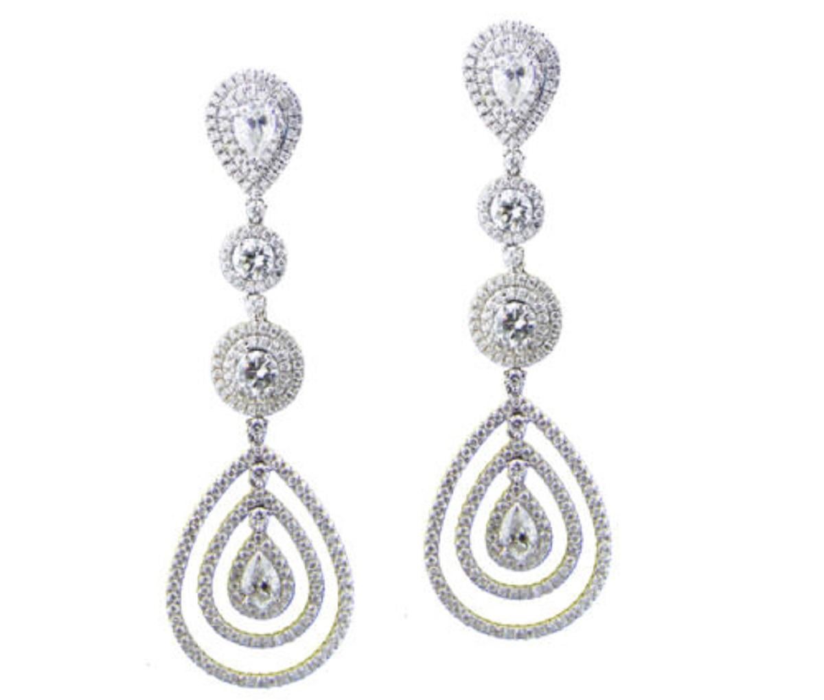 DIAMOND CHANDELIER EARRINGS 6.00 CARATS TOTAL WEIGHT 18K WHITE GOLD

Round Diamonds Total Carat Weight 1.37 carats (With GIA Certificate)

Diamonds are G in Color and SI2 in Clarity 

Pear Shape Diamonds Total Carat Weight 1.80 carats

Diamonds are