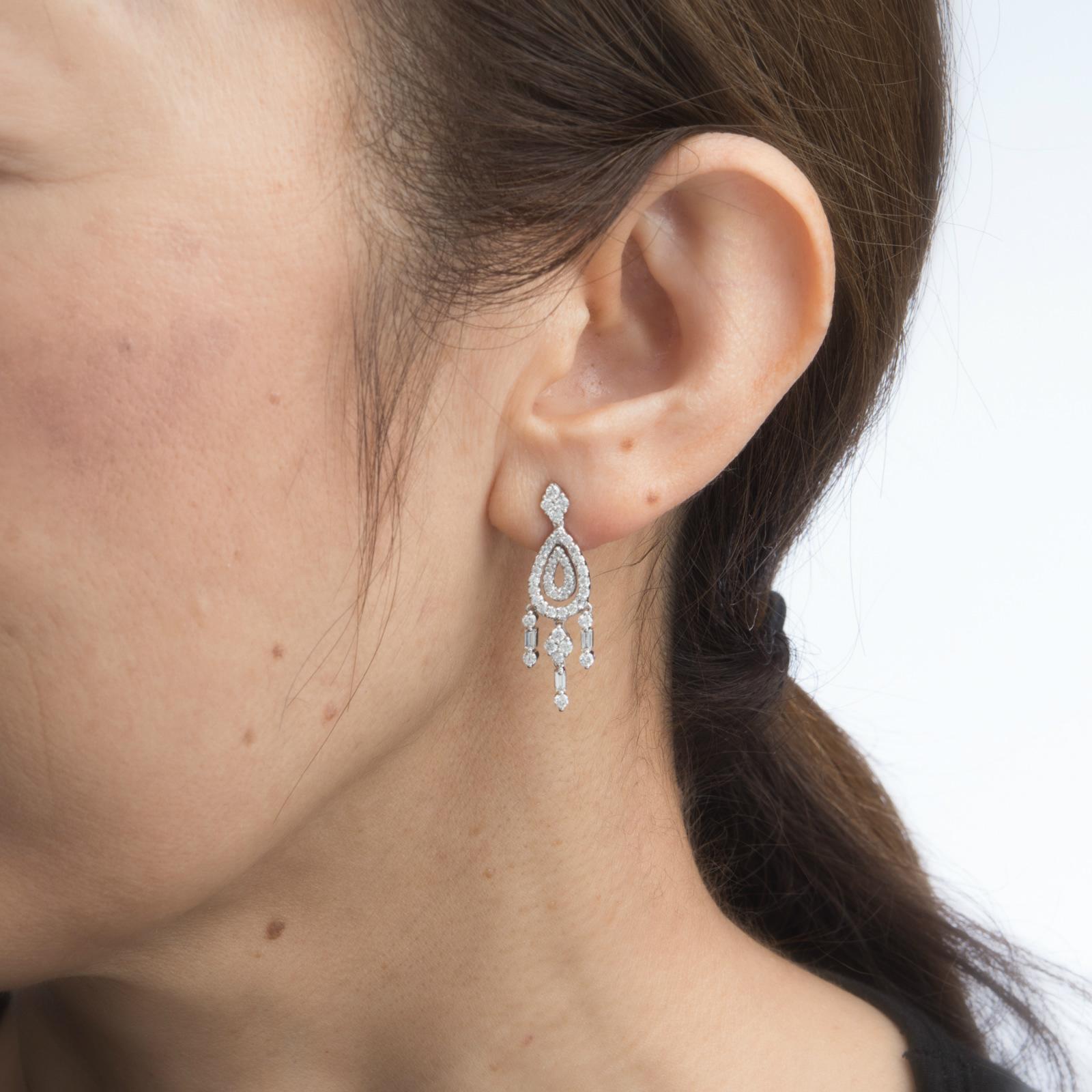 Elegant pair of diamond chandelier earrings, crafted in 18k white gold. 

Round brilliant and straight baguette cut diamonds total an estimated 1.04 carats (estimated at G-H color and VS2-SI1 clarity). 

Set with shimmering mixed cut diamonds the