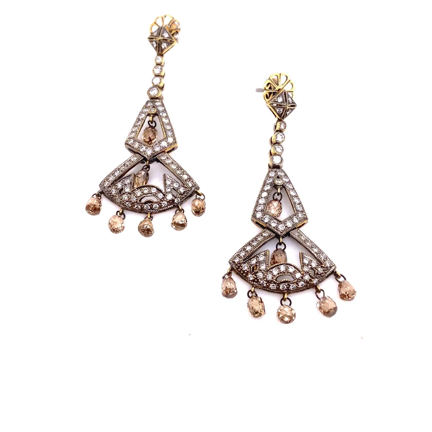 A magnificent pair of chandelier diamond earrings, with a Victorian inspired charm. Crafted in 18k gold, these earrings feature 4 carats total weight of champagne diamonds and round diamonds.  Champagne diamonds with a total of 2.5 carats are