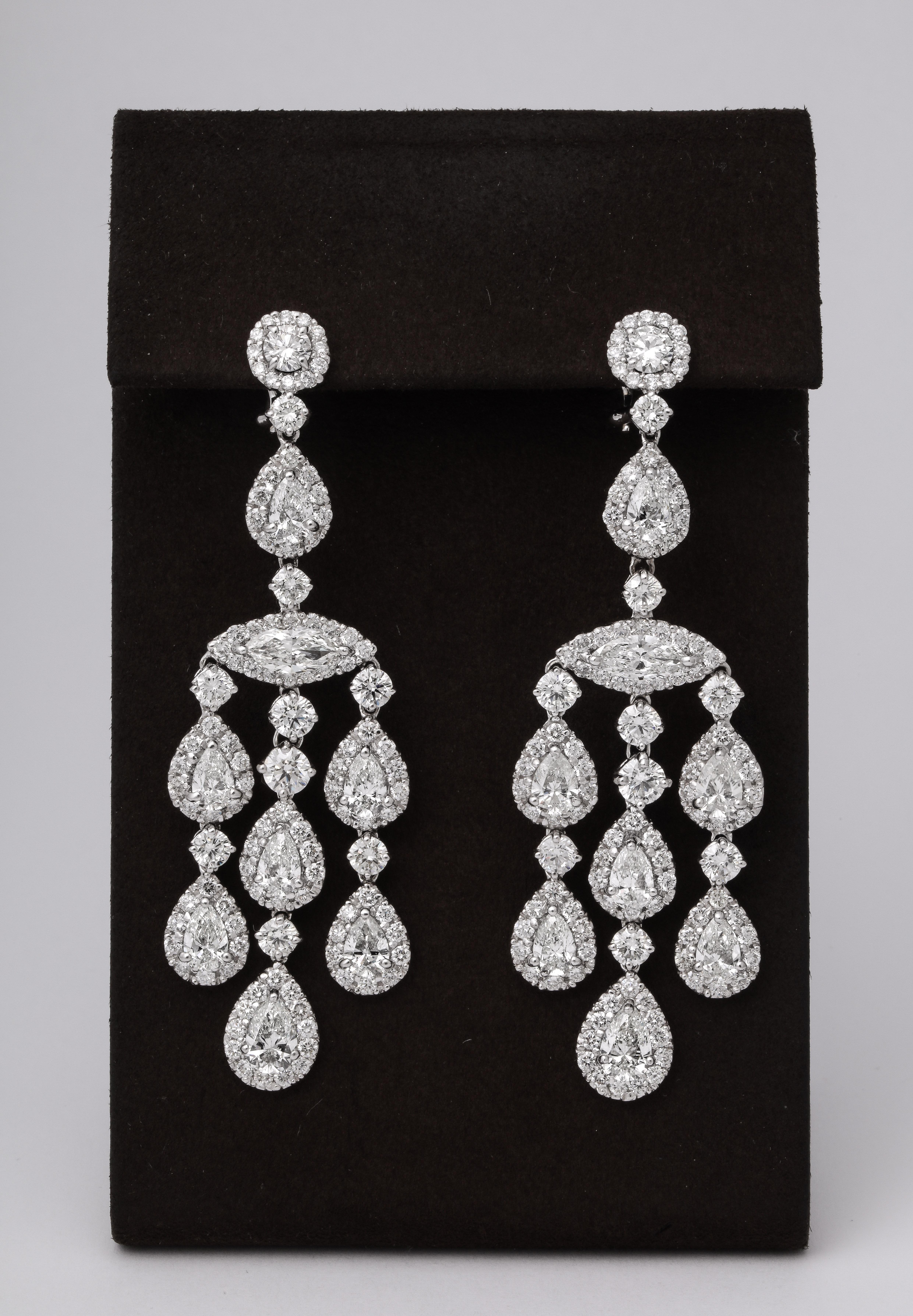 
23.14 carats of white round, pear shape and marquise diamonds set in 18k white gold.

Just over 3 inches in length, .80 inches wide.

A rich chandelier earring with great movement and sparkle!