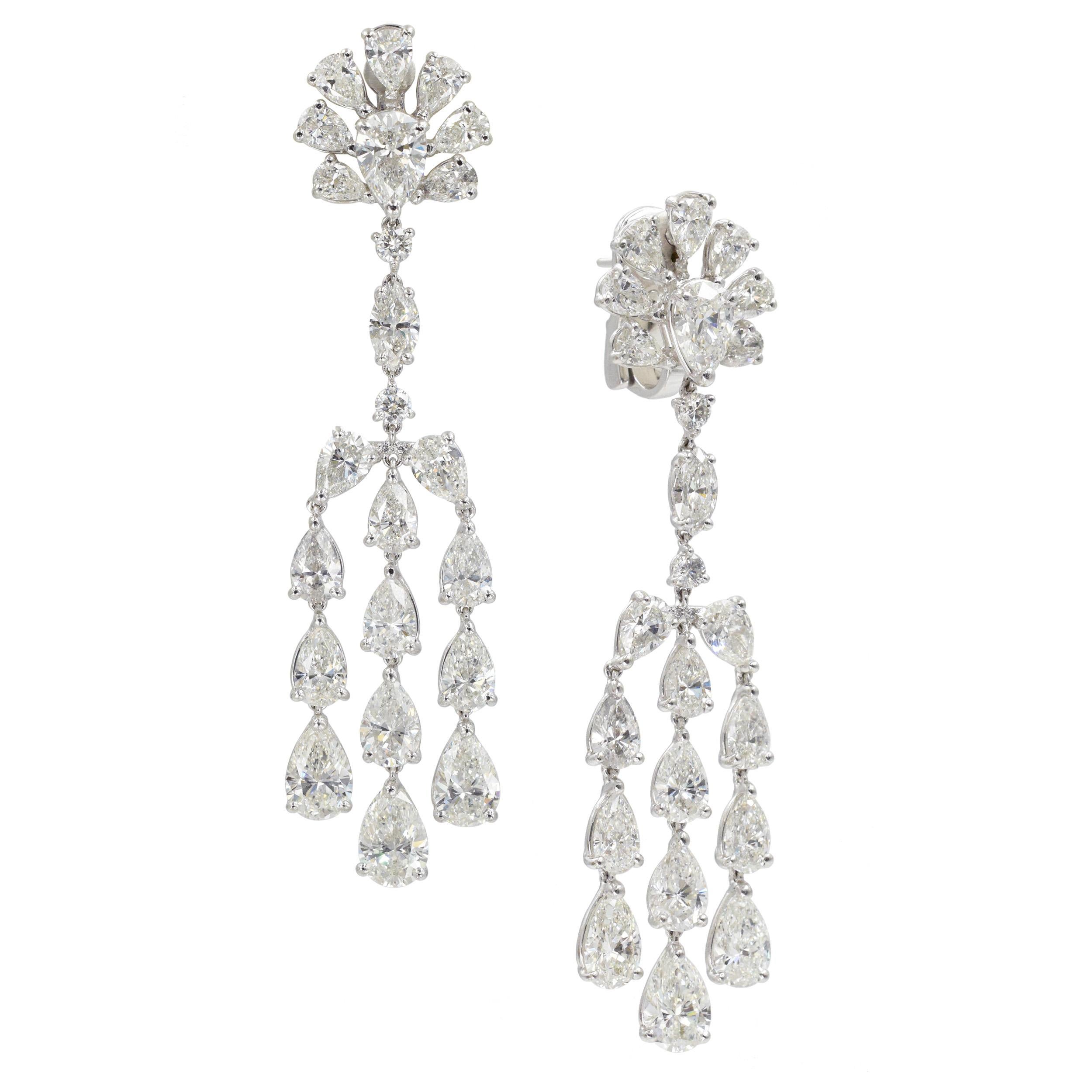 Diamond chandelier earrings in 18k white gold. The earrings feature cluster design at the top, with a three
stands of cascading diamonds drops. Equipped with the
post and omega back closure. Set with total of 40 pear shape diamonds, 4 round briliant
