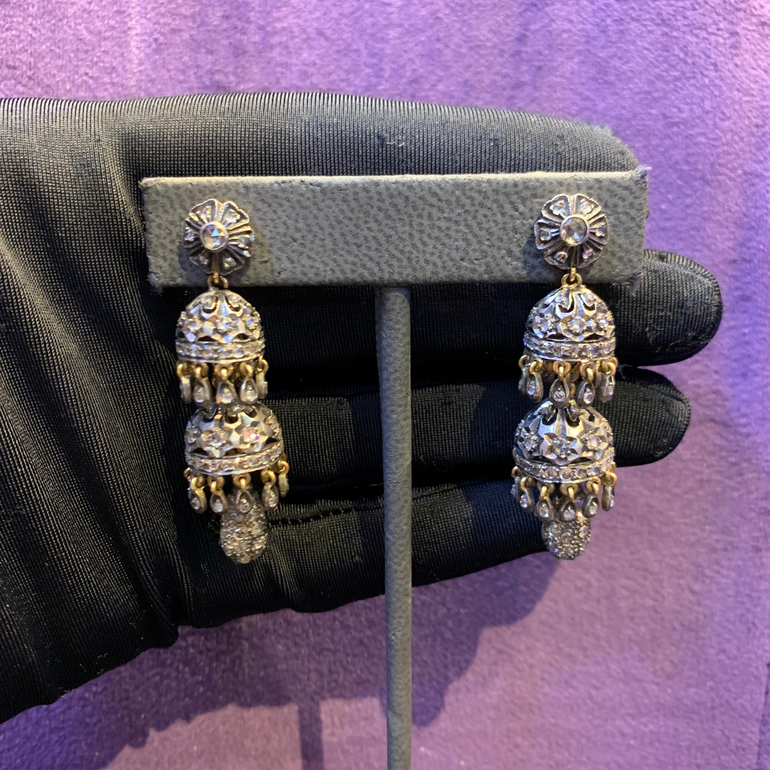 Diamond Chandelier Earrings

A pair of 18 karat gold and silver earrings set with 216 rose cut diamonds weighing approximately 2.2 carats

Length: 2