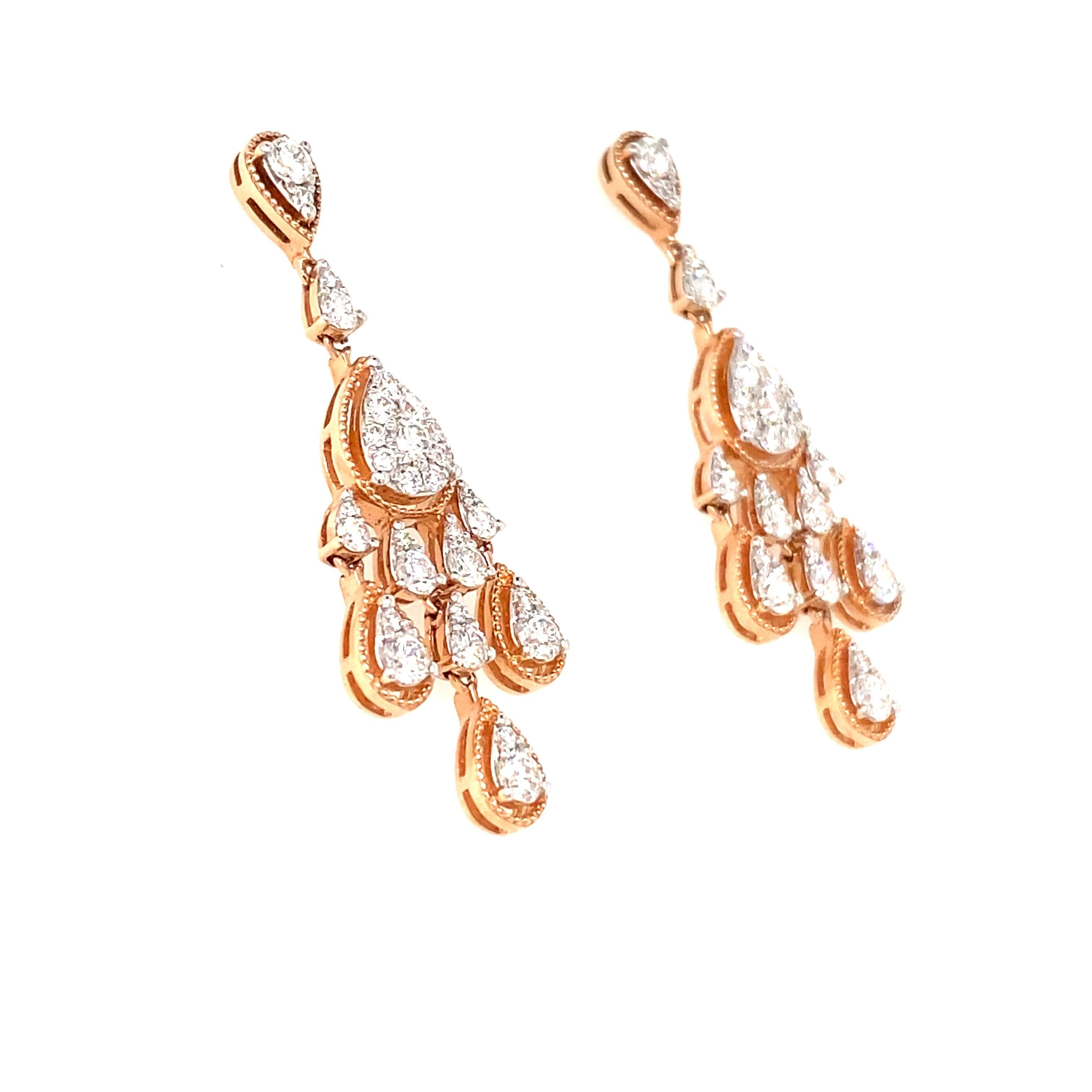 14KT Diamonds framed in Rose & White Gold  Earrings.

Chandelier Drop Earrings  with elegant  Diamond drops which shimmer when you gracefully move. 

60 Round Brilliant Diamonds .32 Carat Total Weight  H-I/I.
Post  Back 