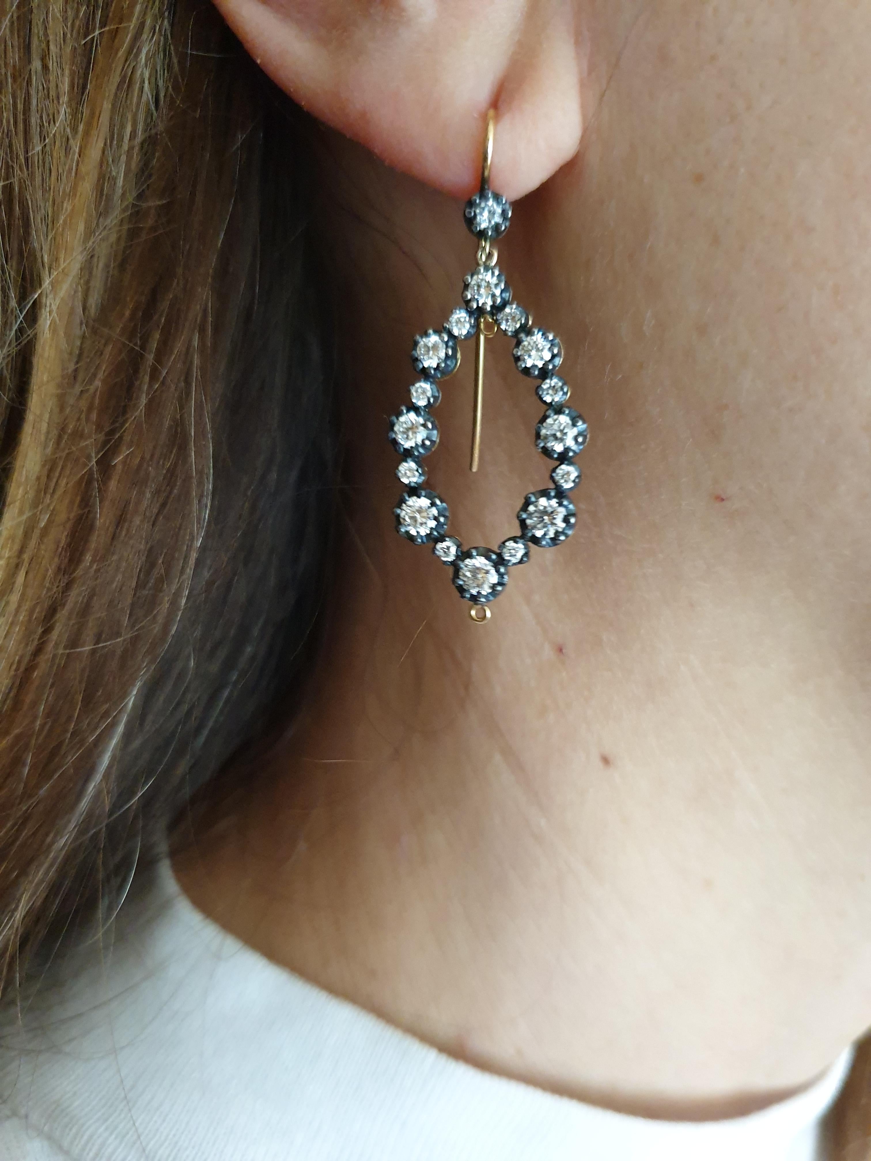 Handmade, silver topped gold brilliant cut diamond earrings, chandelier style.
