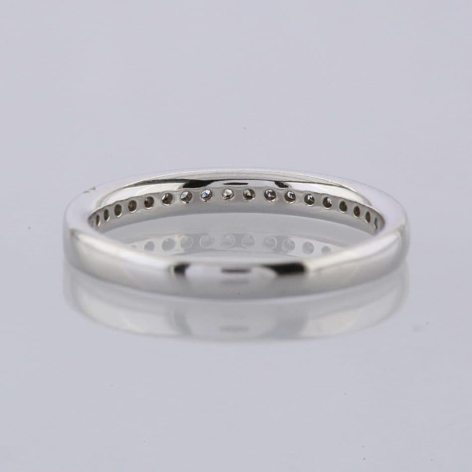 This is an 18ct white gold diamond half eternity ring. The ring plays host to 25 claw set round brilliant cut diamonds.

Condition: Used (Excellent)
Weight: 2.9 grams
Size: L 1/2
Band Width: 2.5mm - 2mm
Total Diamond Carat Weight: Approx. 0.25