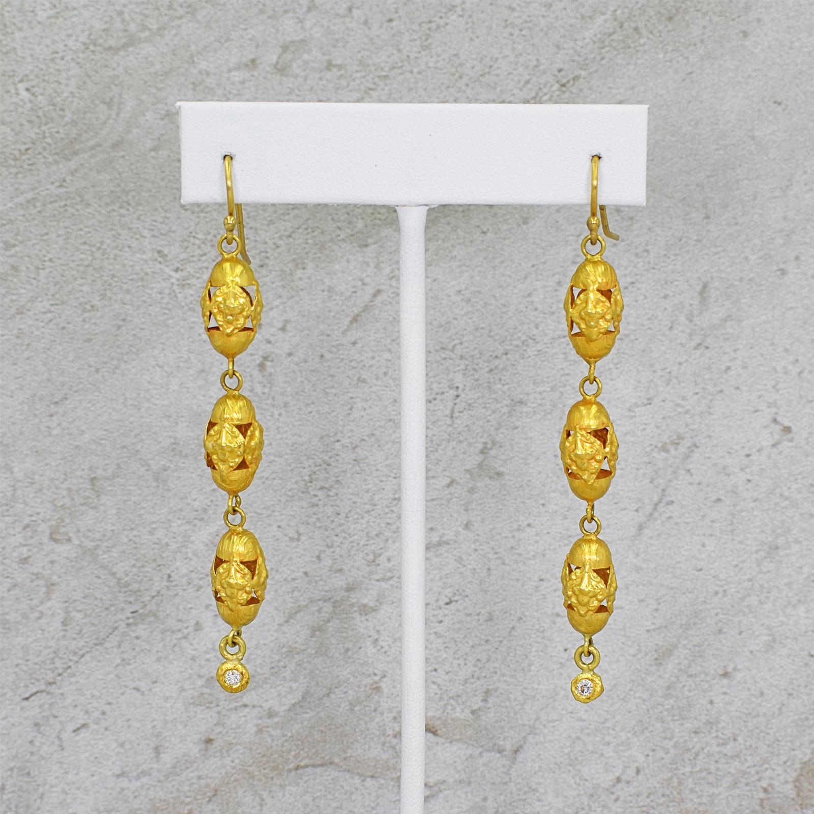 White Diamond charms (0.12 total carat weight, G-H, SI1) on 22k yellow gold three tier vintage filigree beads and French wire dangle earrings. Dangle earrings are 3 inches in total length, and come with silicone backs for added comfort, support and
