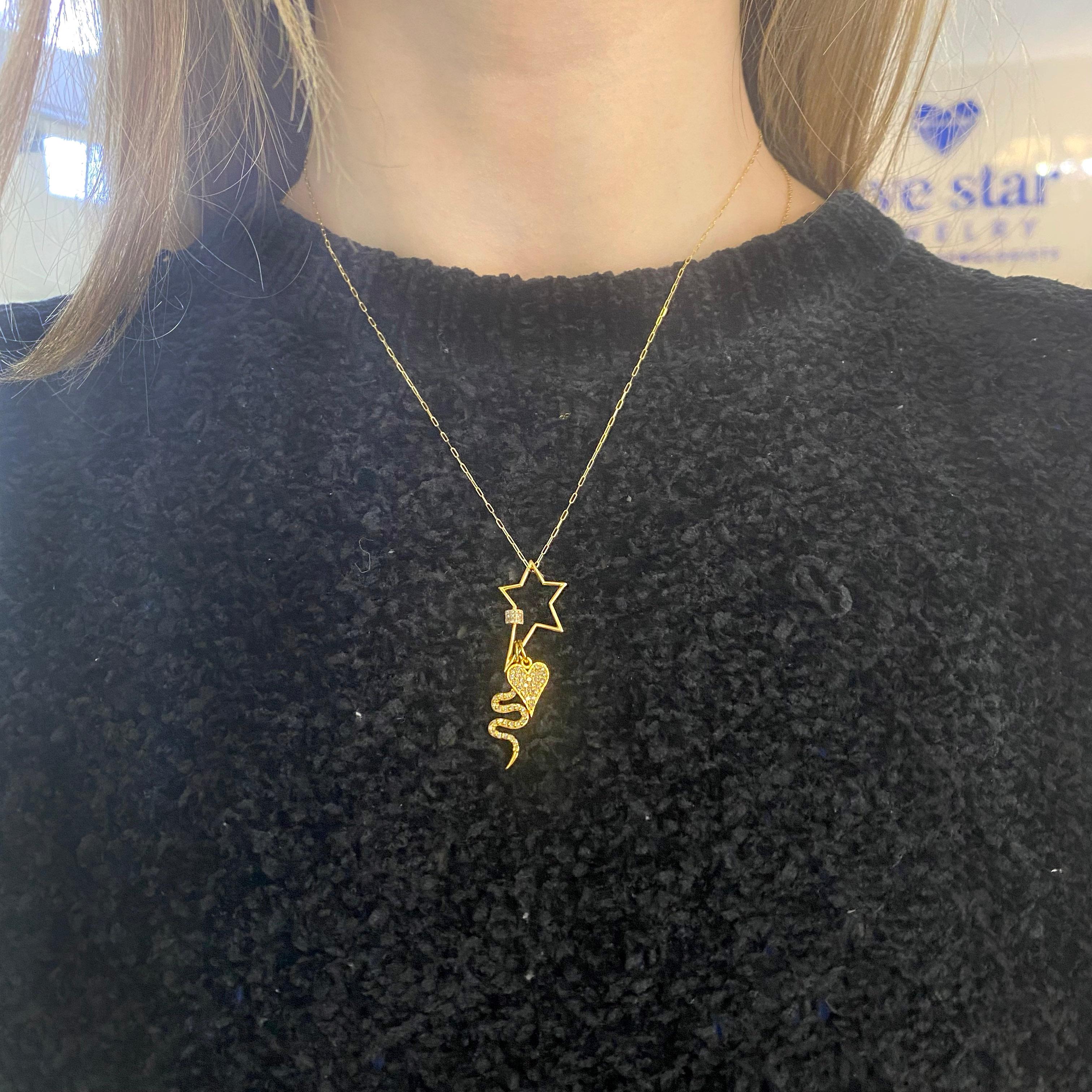 This extraordinary necklace includes the star clasp, snake charm, heart charm, and includes the paperclip necklace and they are all made in solid 14 karat gold and embellished with gorgeous full cut diamonds. Be original and unique with this smart