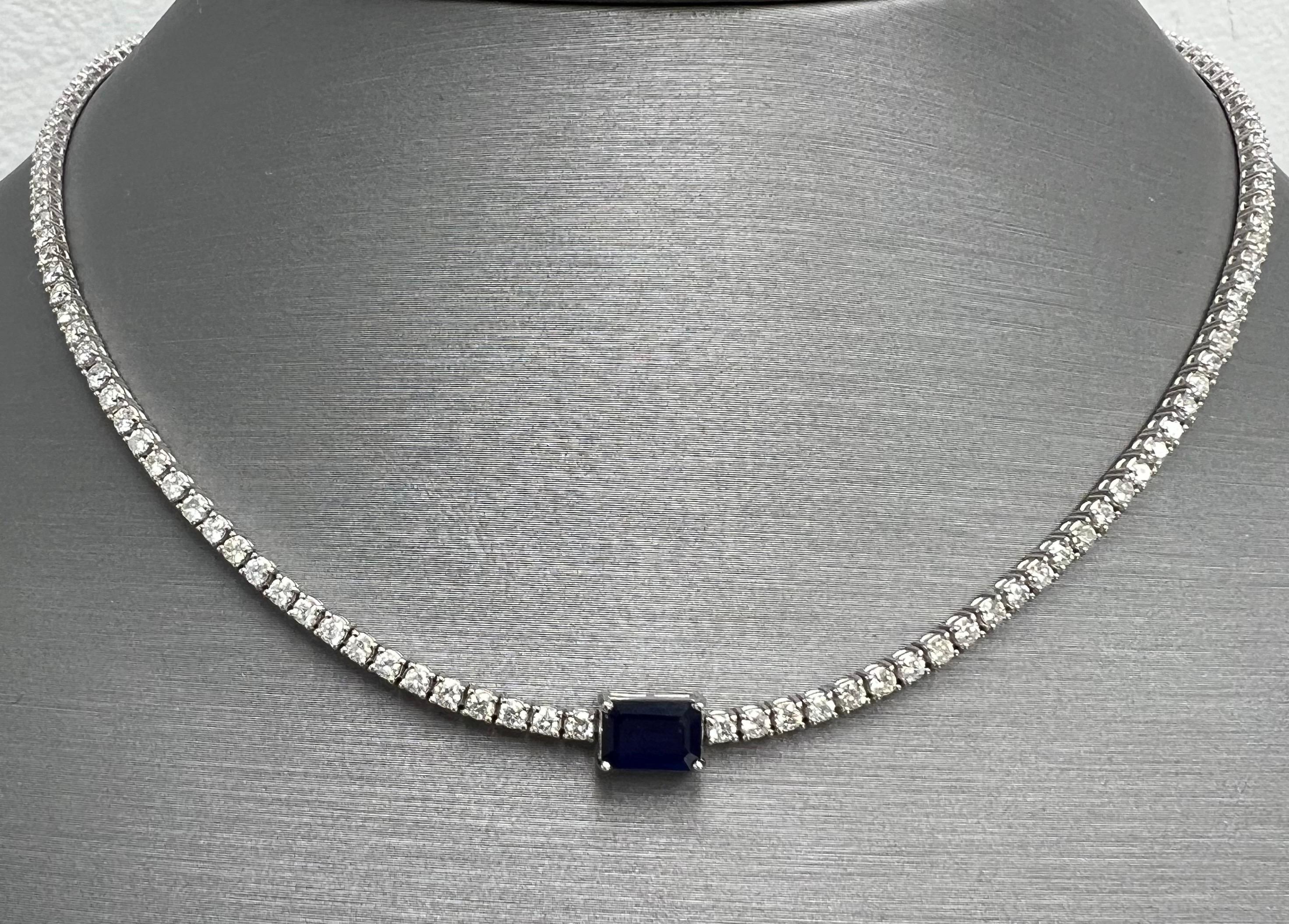 Diamond Choker Necklace in 14k white with 1.02ct of Natural Emerald Cut Sapphire
3.41 Total Carat Weight of Natural Full Cut Diamonds
1.02 Total Carat Weight of Natural Emerald Cut Blue Sapphire
14k White Gold
Adjustable Necklace Size: from 13