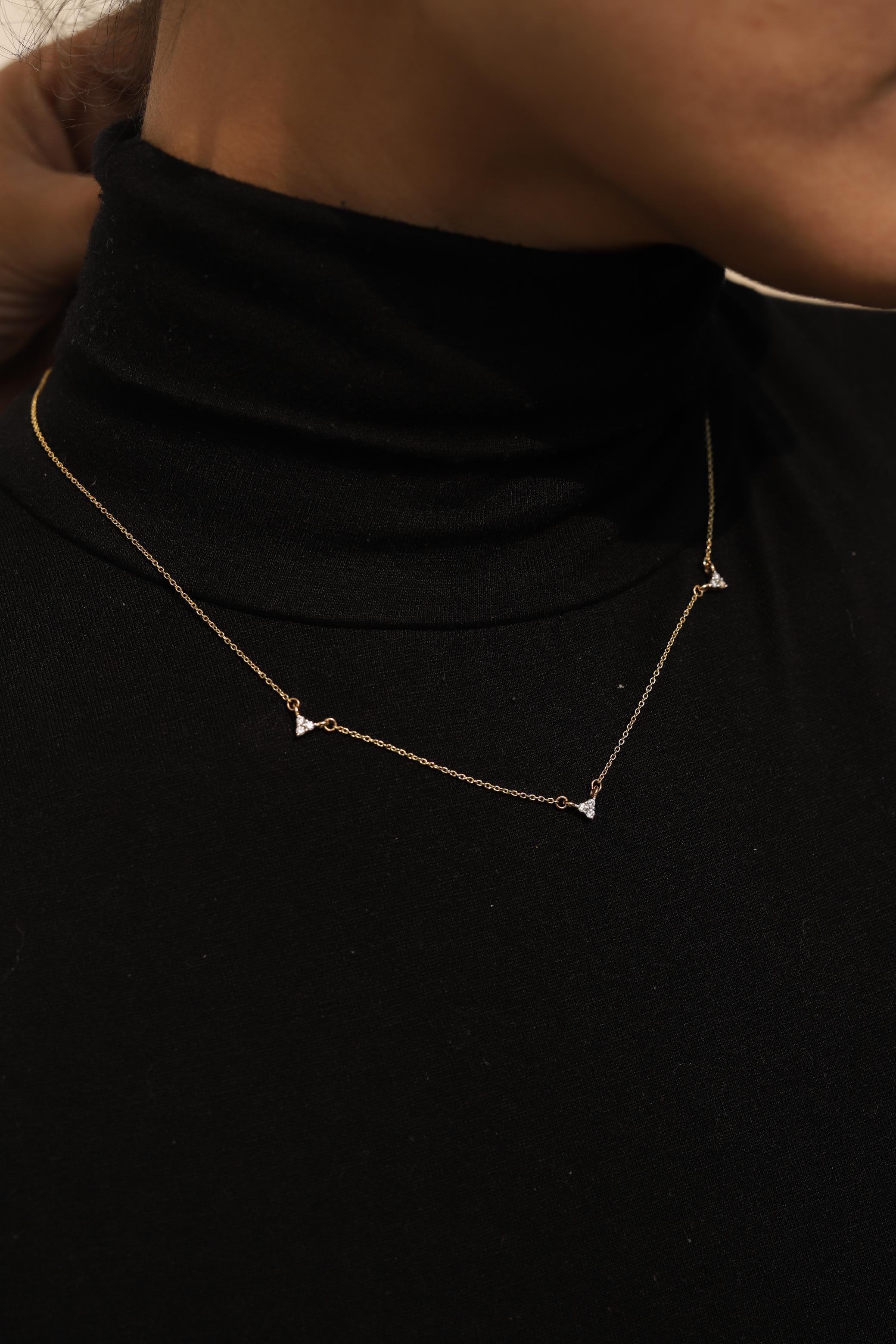 Minimalist Diamond Chain Necklace in 14K Gold studded with round cut diamond. This stunning piece of jewelry instantly elevates a casual look or dressy outfit. 
April birthstone diamond brings love, fame, success and prosperity.
Designed with three