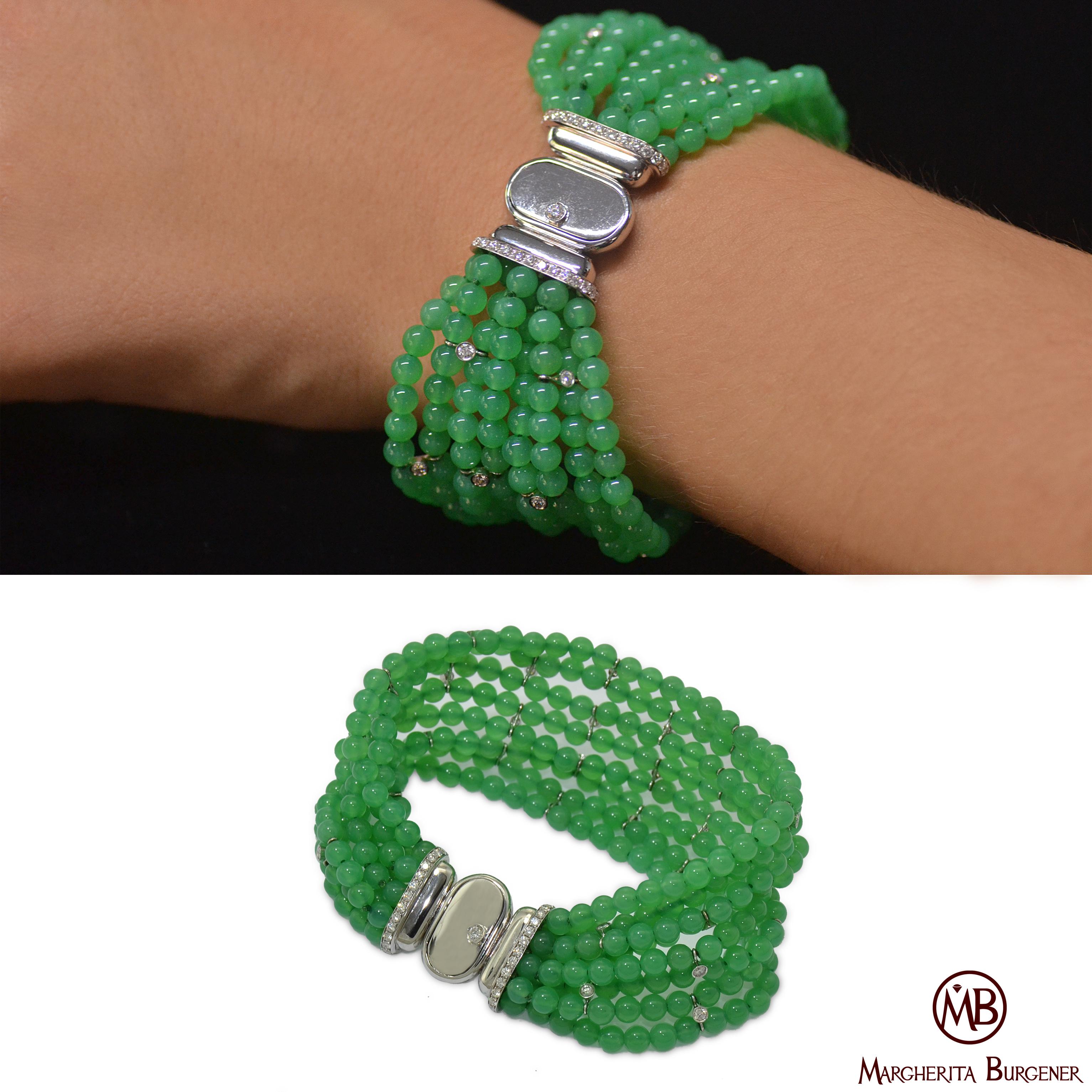 Flexible bracelet,  handcrafted in Margherita Burgener workshop, Italy.
Very chic and comfortable.
8 little balls strands of chrysoprase are highlighted by single diamonds, bezel set on white gold.

18 KT white gold g 11.40 
n. 67 diamond ct 1.30 
