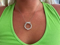 Diamond Circle Bow Necklace in Platinum