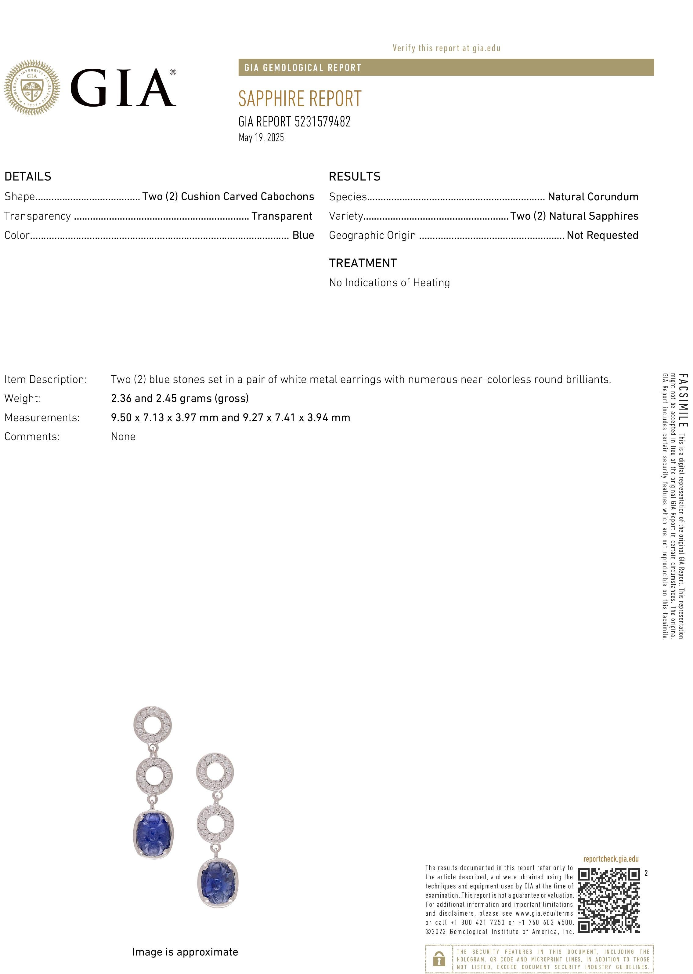 A striking fusion of rarity, elegance, and modern glamour, these 14K White Gold Diamond Circle Drop Earrings feature two intricately carved Burma sapphires totaling 5.22 carats, accompanied by a GIA certificate confirming their natural origin with