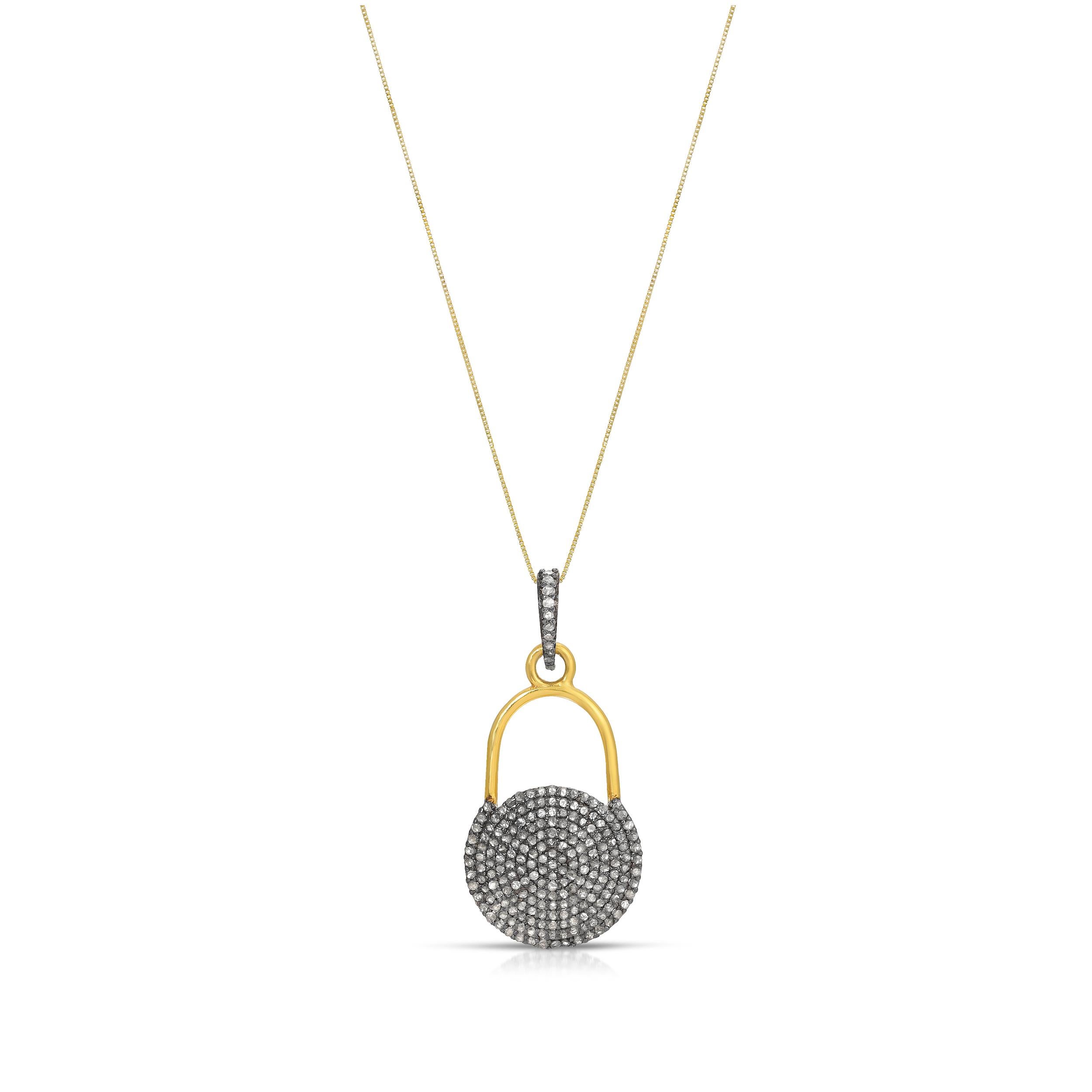 A fabulous diamond pendant featuring a diamond set link suspending a diamond cirque pendant with. This pendant features contrasting 18 Karat Gold overlay and silver accents in a contemporary locket design on an 18 inch 14 Karat fine gold chain.