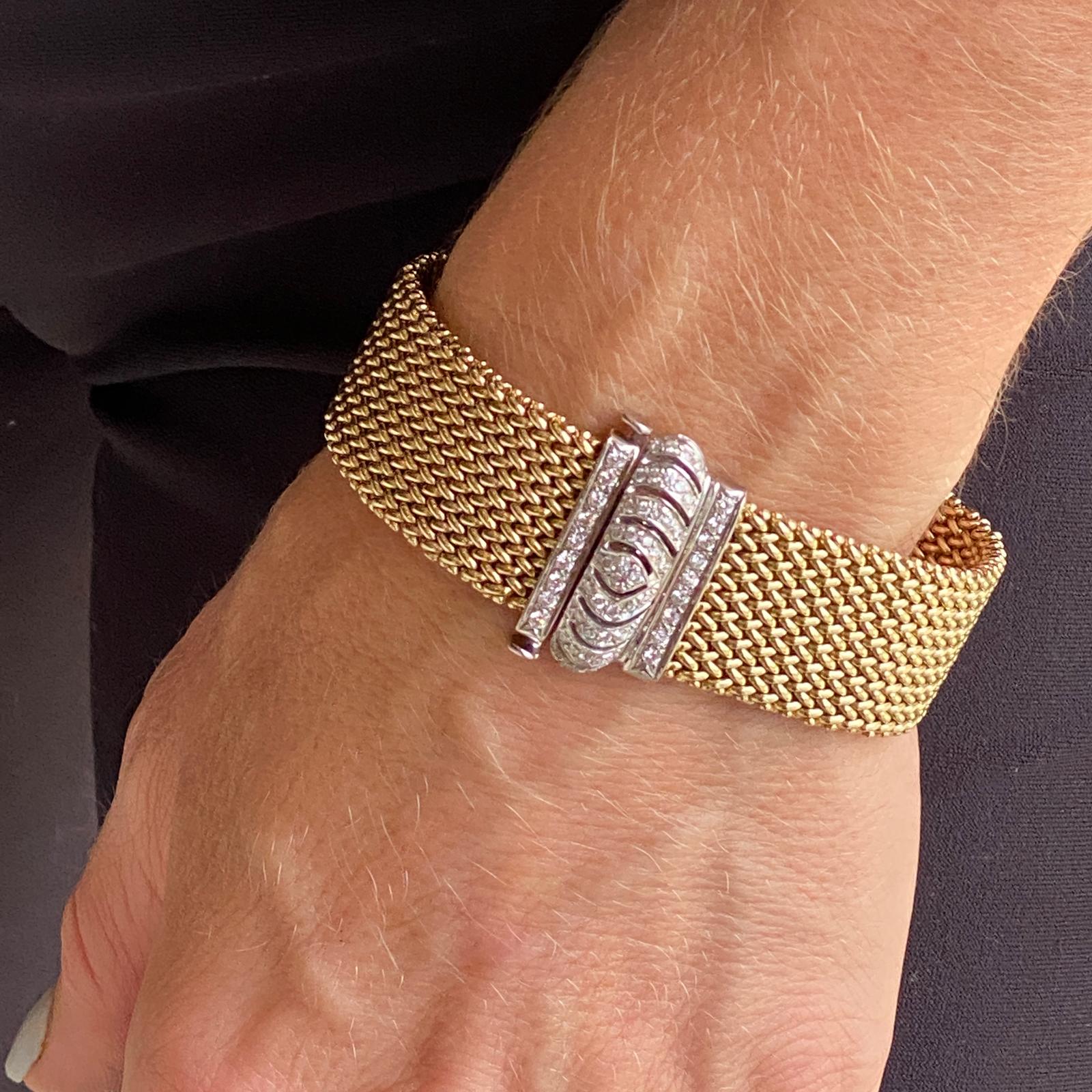 Beautiful diamond clasp woven gold bracelet fashioned in 14 karat yellow and white gold. The clasp features 57 round brilliant cut diamonds weighing .75 carat total weight and graded H-I color and SI clarity. The woven link bracelet measures 7