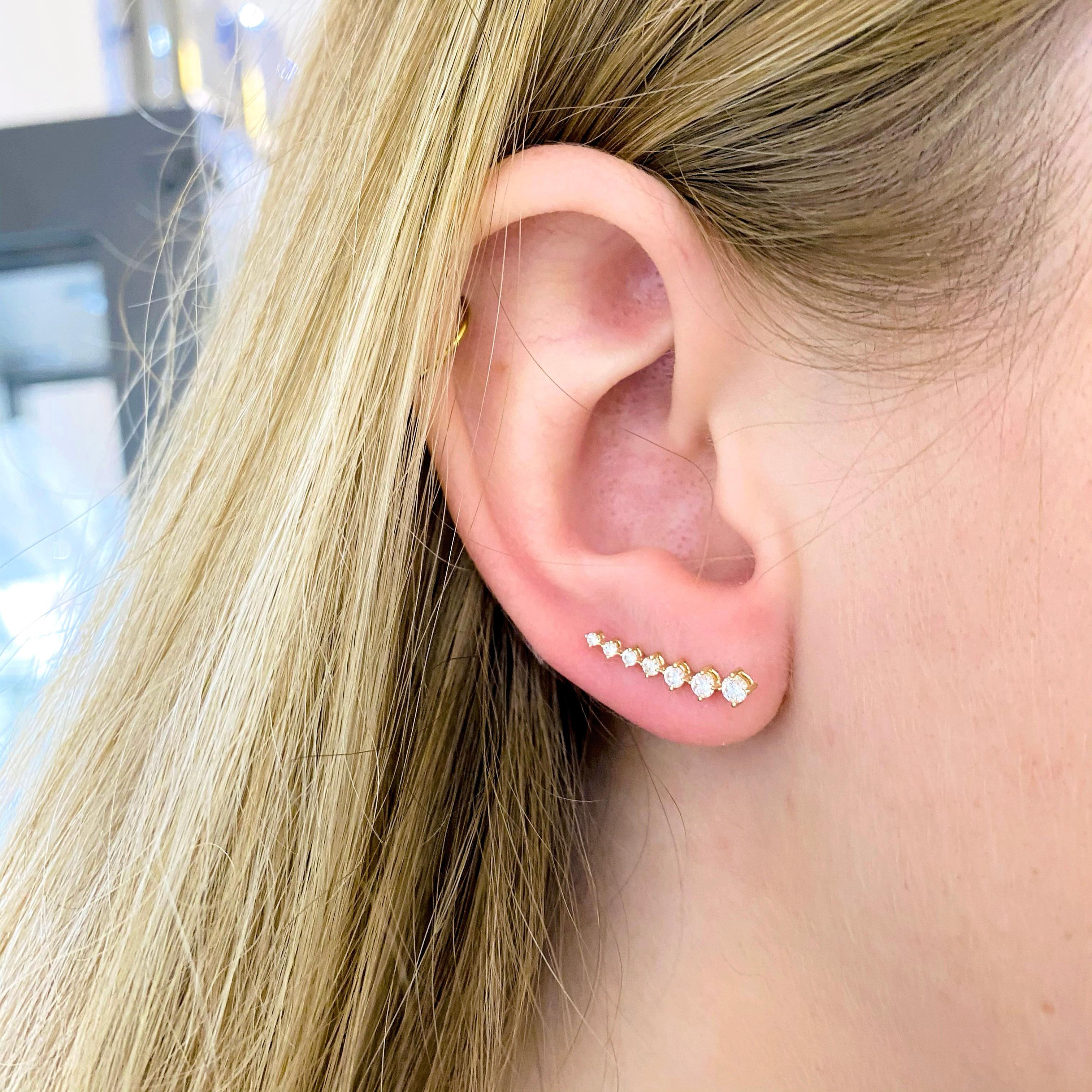 These stunning Gabriel & Co. 14k yellow gold ear climbers dripping with diamonds provide a look that is both trendy and classic. These diamond earrings are a great staple to add to your collection, and can be worn with both casual and formal wear. 