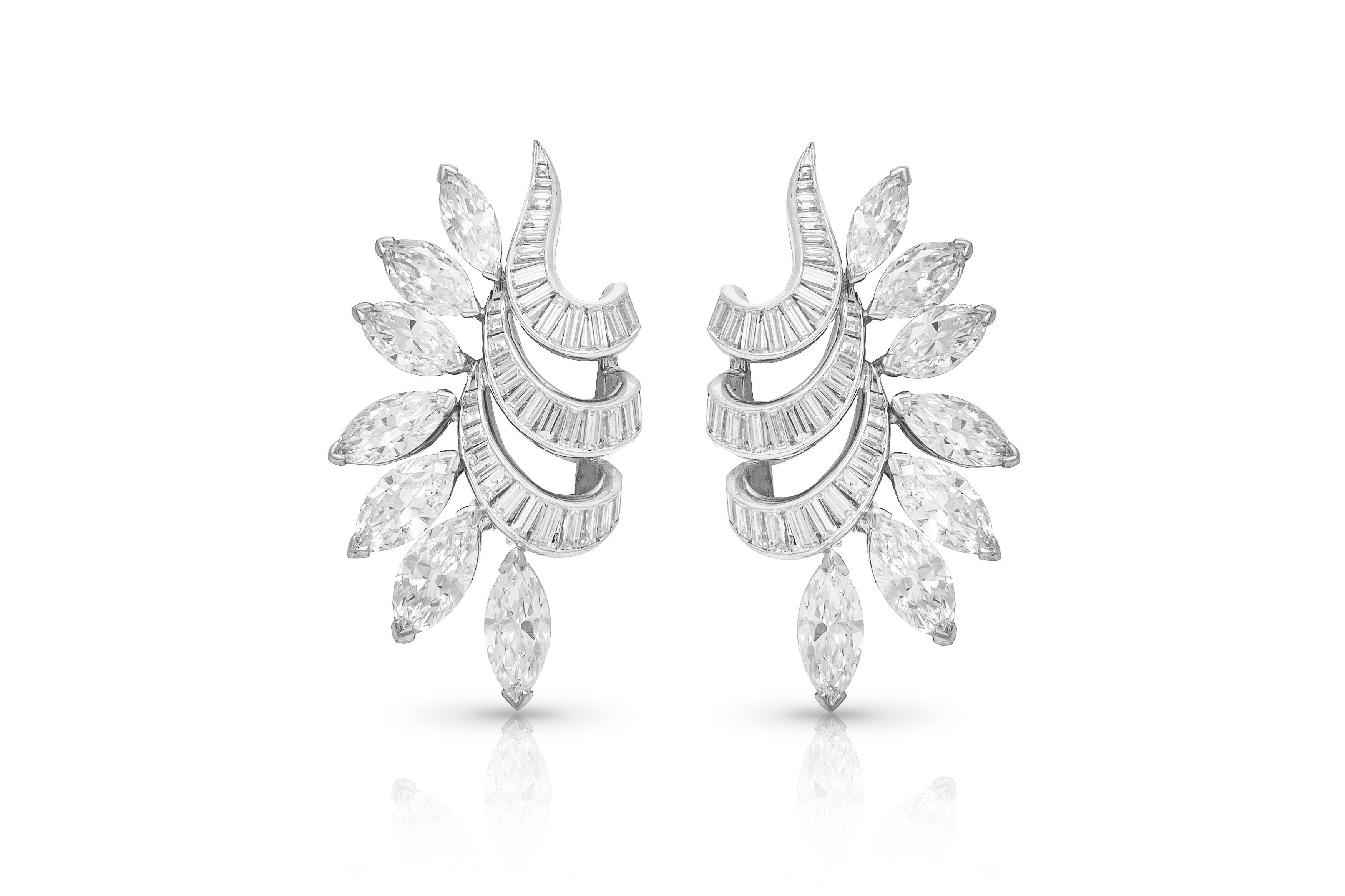 Clip-on earrings, finely crafted in platinum with diamonds weighing approximately a total of 16.00 carat. Circa 1950's.