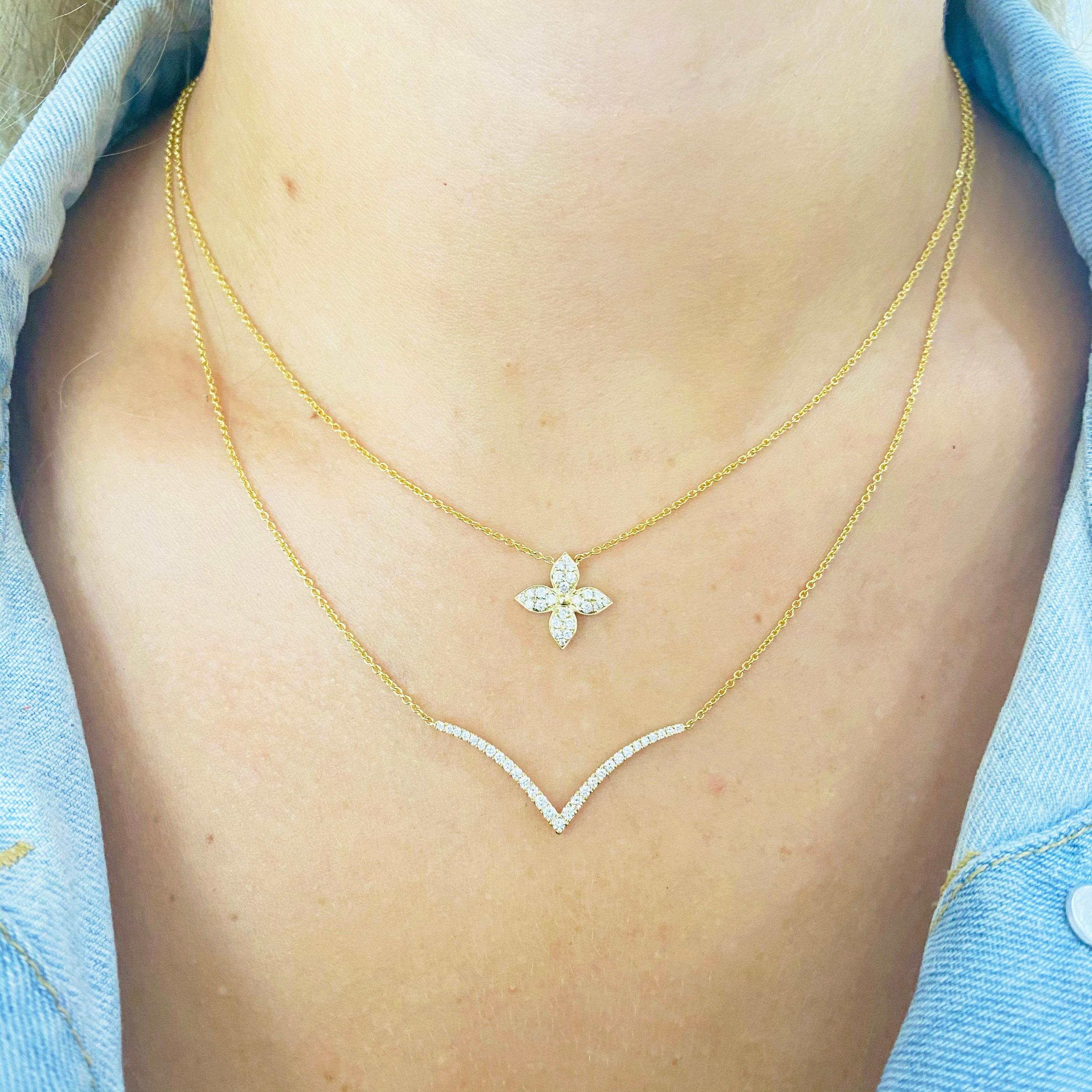 This gorgeous 14k yellow gold flower pendant dripping with diamonds is sure to put a smile on anyone's face! This necklace looks beautiful worn by itself and also looks wonderful in a necklace stack. This necklace would make a wonderful gift for