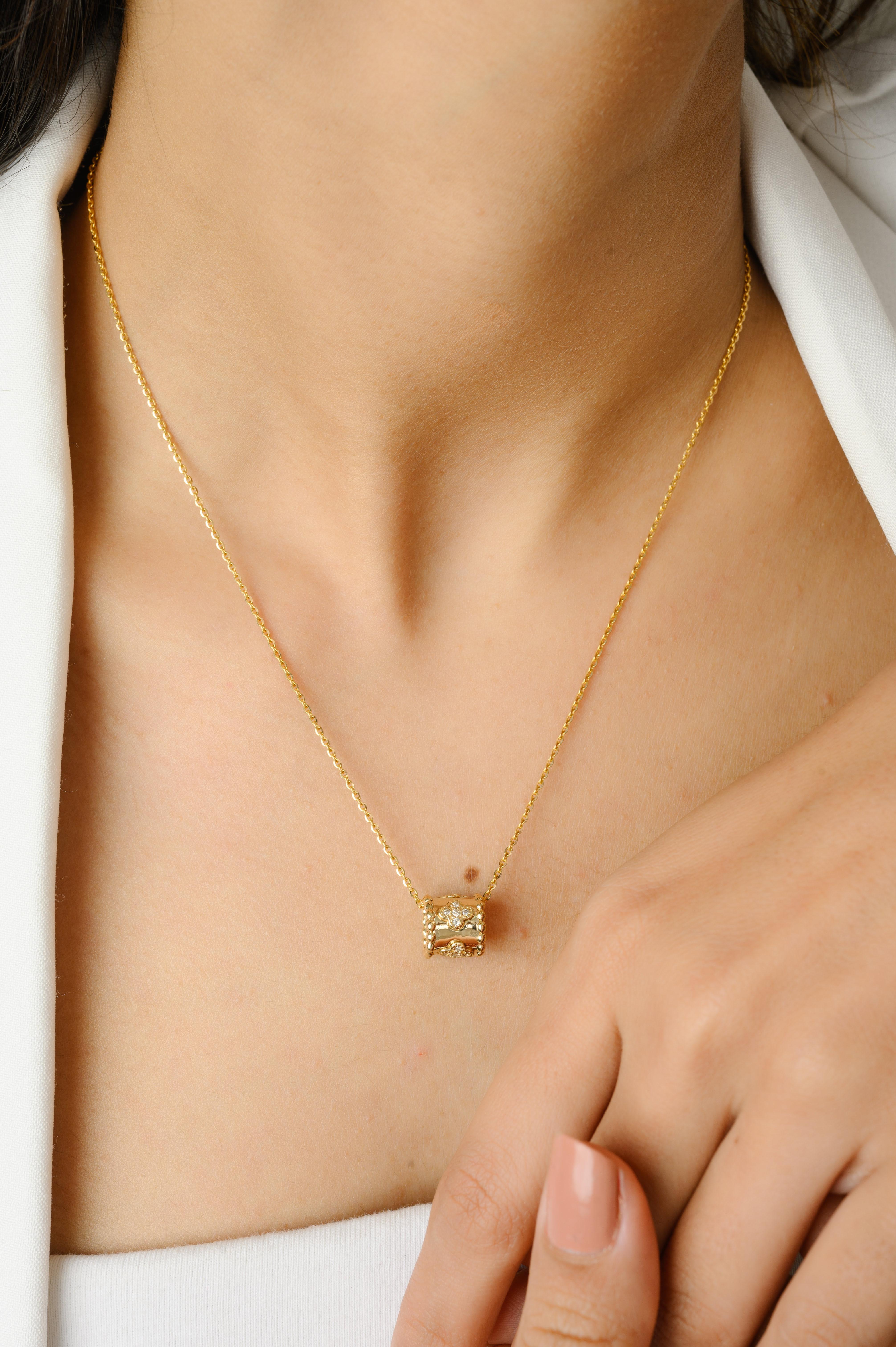 Diamond Clover Roller Pendant Chain Necklace in 14K gold studded with round cut diamond. This stunning piece of jewelry instantly elevates a casual look or dressy outfit. 
April birthstone diamond brings love, fame, success and prosperity.
Designed