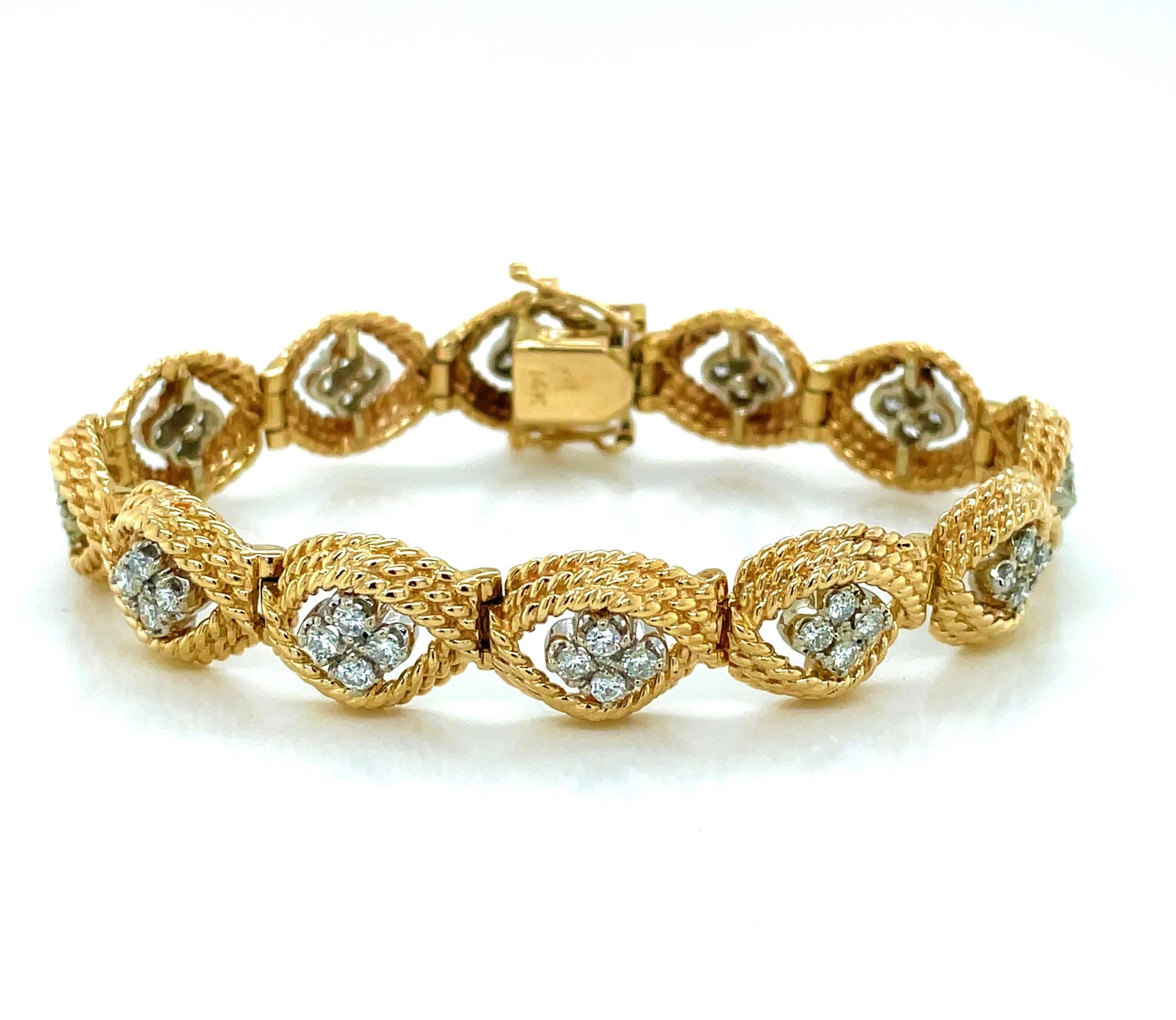 A total of 2.4 carats of H/VS diamonds light up the length of this elegant 14 karat yellow gold dress bracelet. Presented in quads, twelve clusters of .05 carat diamond gemstones float centered amid uniquely crafted oval shaped twists of gold that