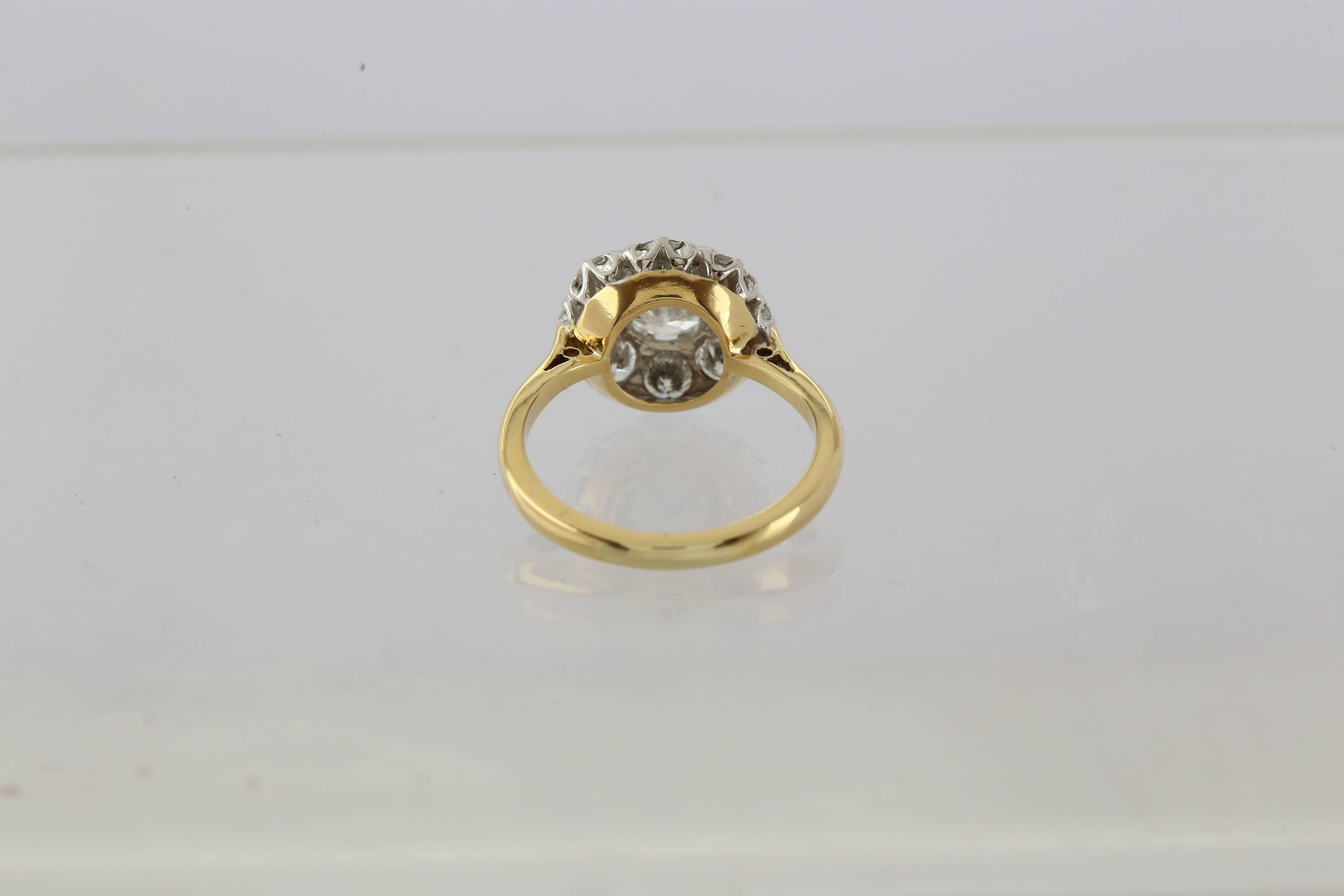 18ct Yellow Gold Diamond Cluster Ring Centre Diamond 0.90ct,Colour G, Clarity SI2, Cut VG set with 8 round brilliant diamonds total weight 1.20ct, Colour G-H, Clarity SI, Cut VG, Weight 7,94grams WGI9624108337 CERTIFICATED
Size M