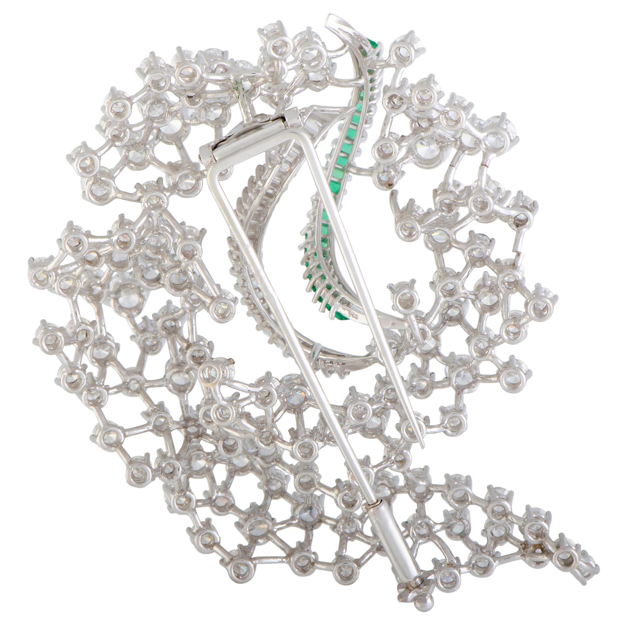 Elevate your style in a stunningly luxurious manner with this incredibly extravagant brooch that boasts an intriguingly intricate design lavishly topped off with a resplendent blend of gems. The brooch is expertly crafted from prestigious platinum