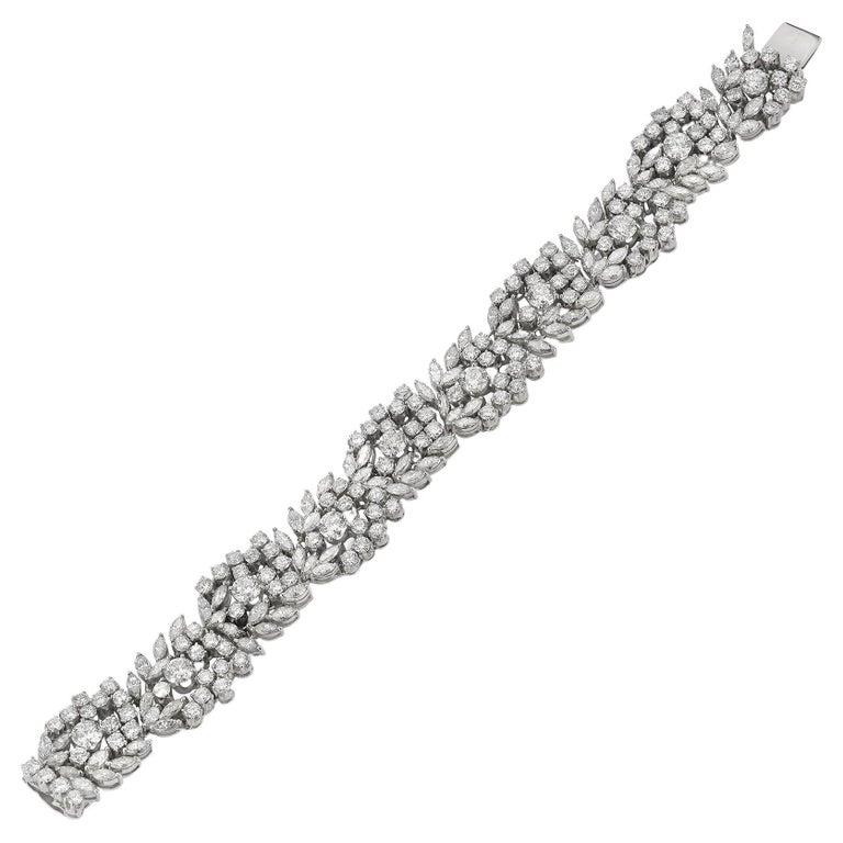 Diamond Cluster Bracelet, with large & small round cut & marquise cut diamonds clustered together set in 18k white gold.

151 small round diamonds - approximately 12.80 cts 
10 larger round diamonds -  approximately  4.50  cts 
90 marquise cut