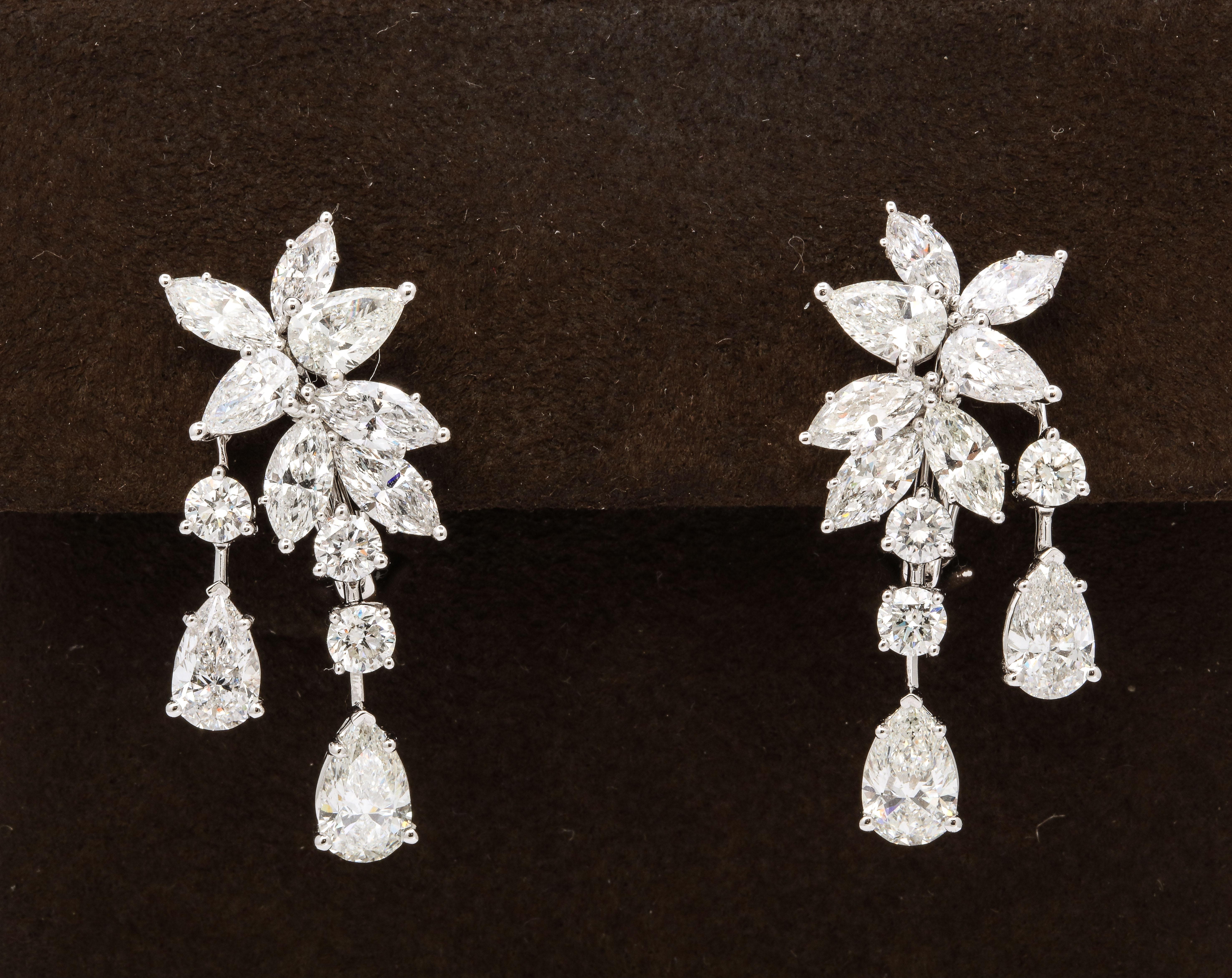 
A unique cluster earring with the perfect amount of *dangle*

8.70 carats of white round brilliant, pear shape and marquise cut diamonds set in 18k white gold. 

Approximately 1.35 inches in length