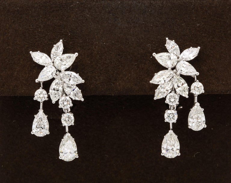 
A unique cluster earring with the perfect amount of *dangle*

8.62 carats of white round brilliant, pear shape and marquise cut diamonds set in 18k white gold. 

Approximately 1.35 inches in length