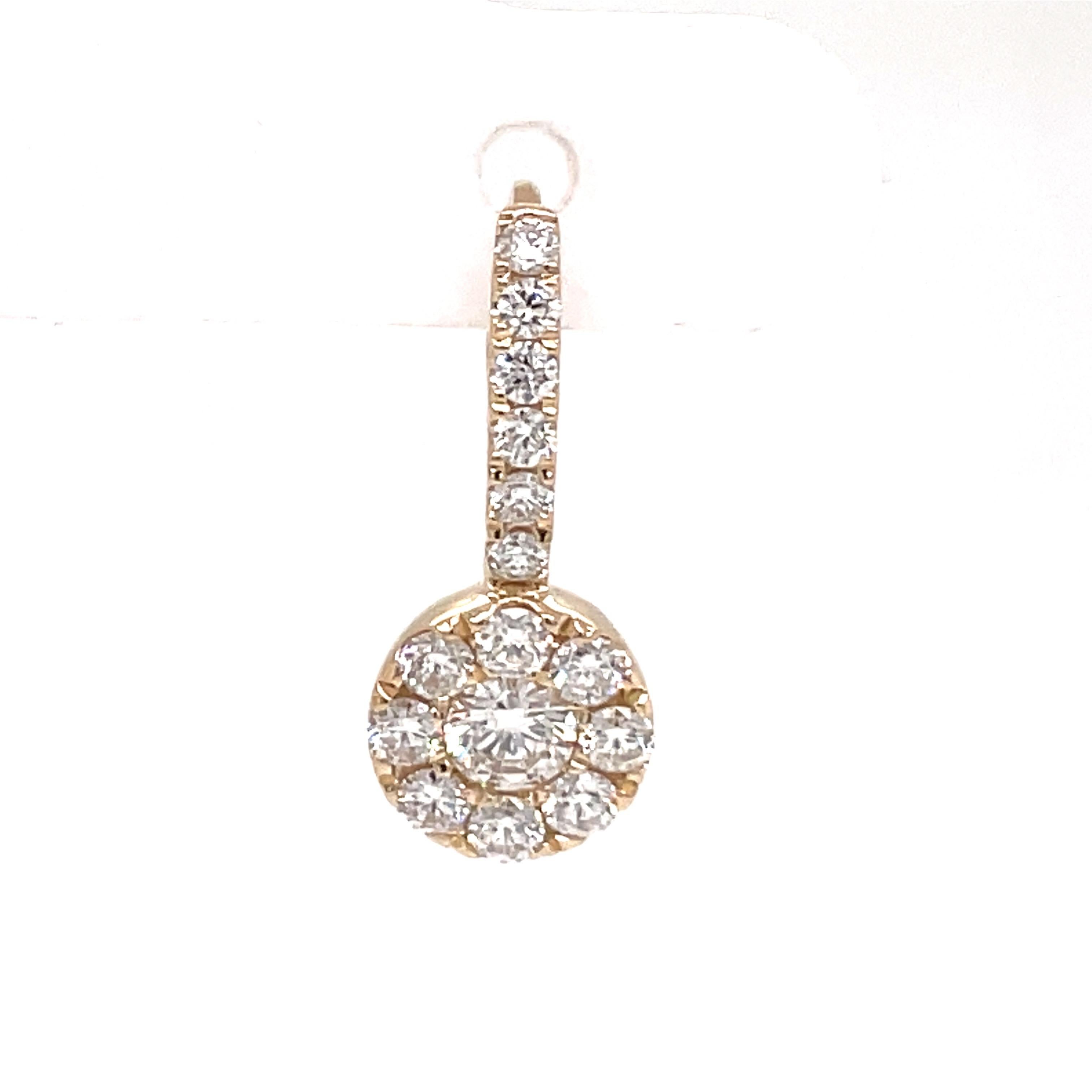 14 Karat Yellow gold drop earrings featuring two center diamonds weighing 0.26 carats flanked with 28 round brilliants weighing 0.56 carats.
Color G-H
Clarity SI

Available in white gold. 