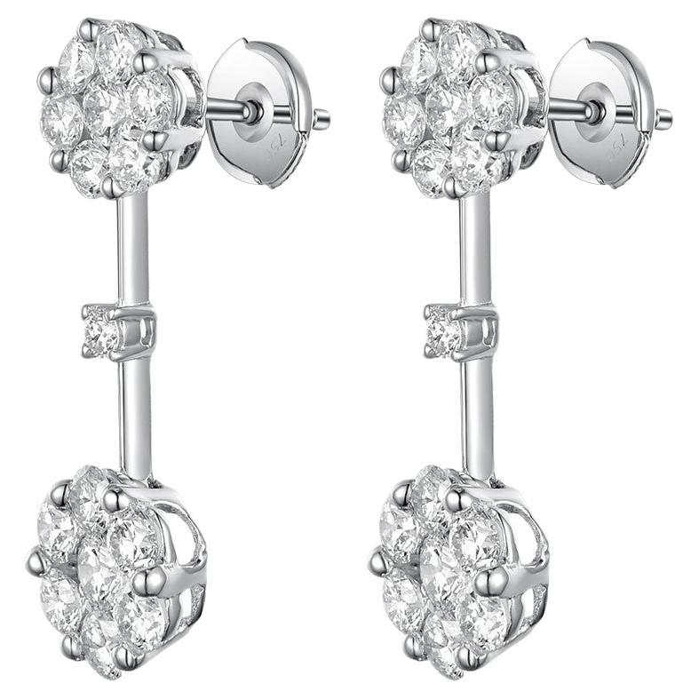 This earrings feature 2.51 carat of white round brilliance cut diamonds. Diamonds are set in a cluster setting. Earrings are set in 18 karat white gold. Diamonds are F-G color, top SI quality. Matching ring is available, please visit our storefront