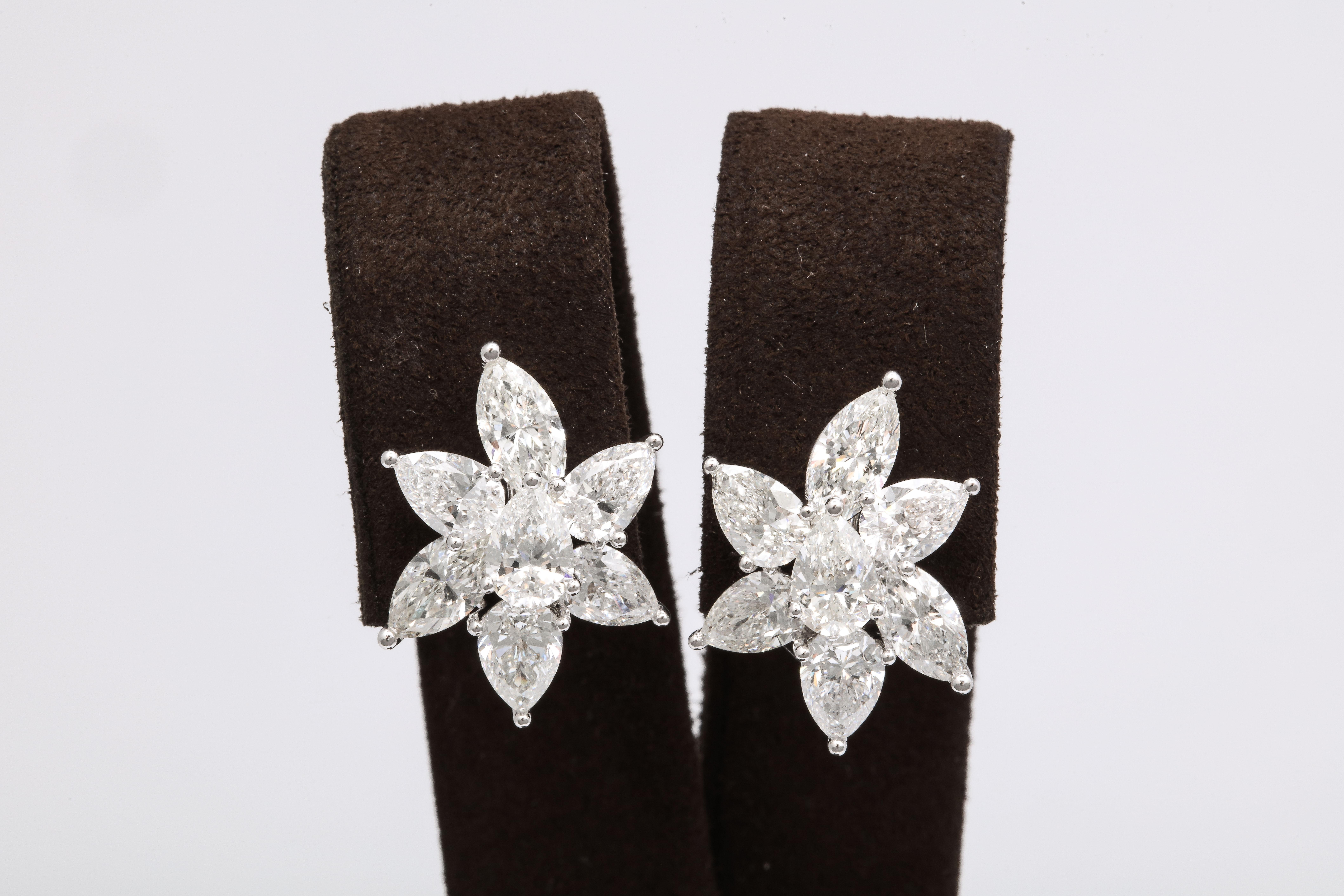 
The perfect pair of cluster earrings!

7.02 carats of white pear and marquise shape diamonds set in 18k white gold. 

The diamonds are all set on different height levels allowing for these earrings to really POP!

Full of sparkle, these earrings