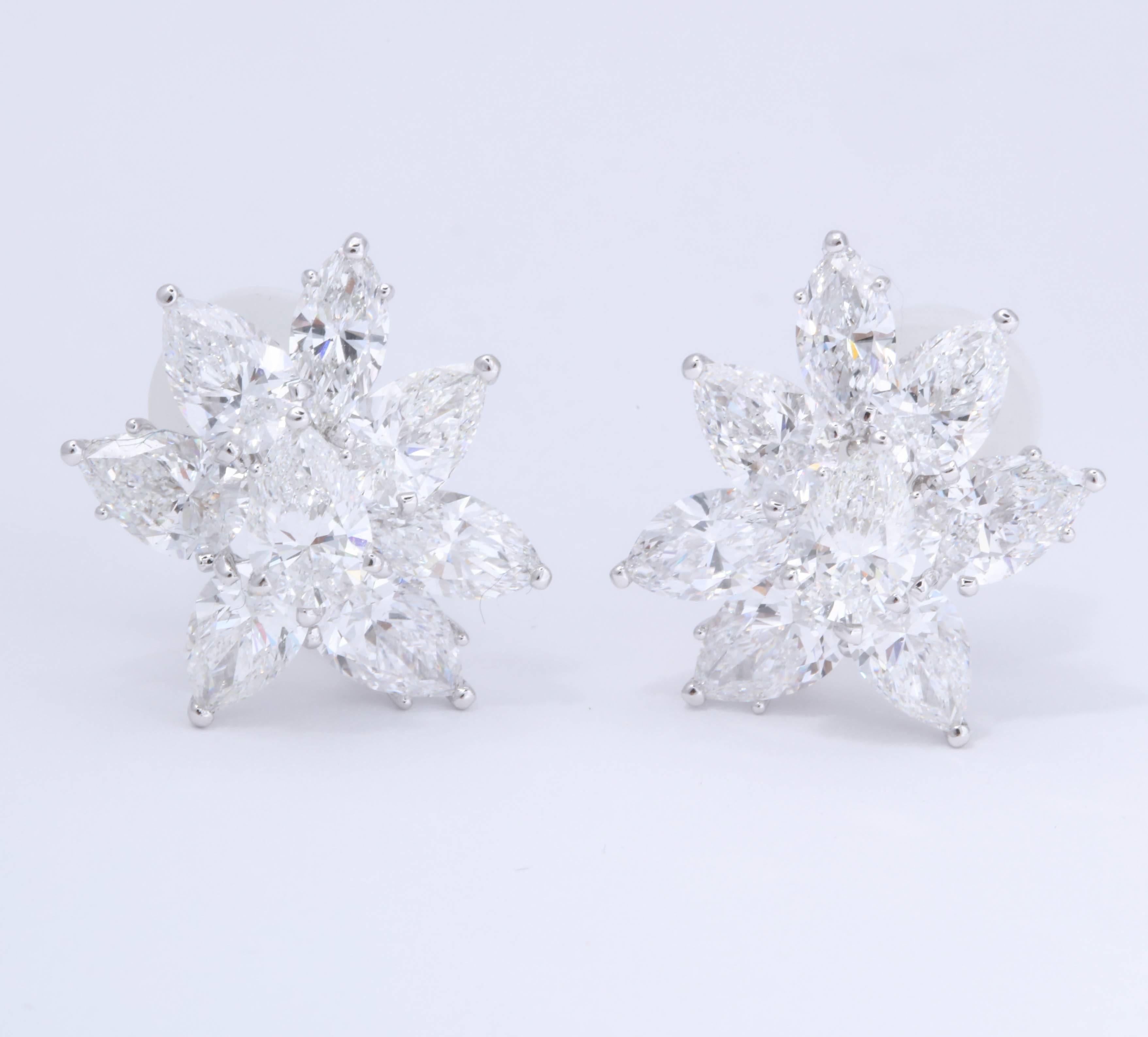 
An incredible pair of diamond cluster earrings. 

The best possible quality -- 7.03 carats of pear shape and marquise diamonds all DEF white diamonds, VS2-VVS2 clarity each stone comes with a GIA certificate. 16 total GIA certificates. 

18k white