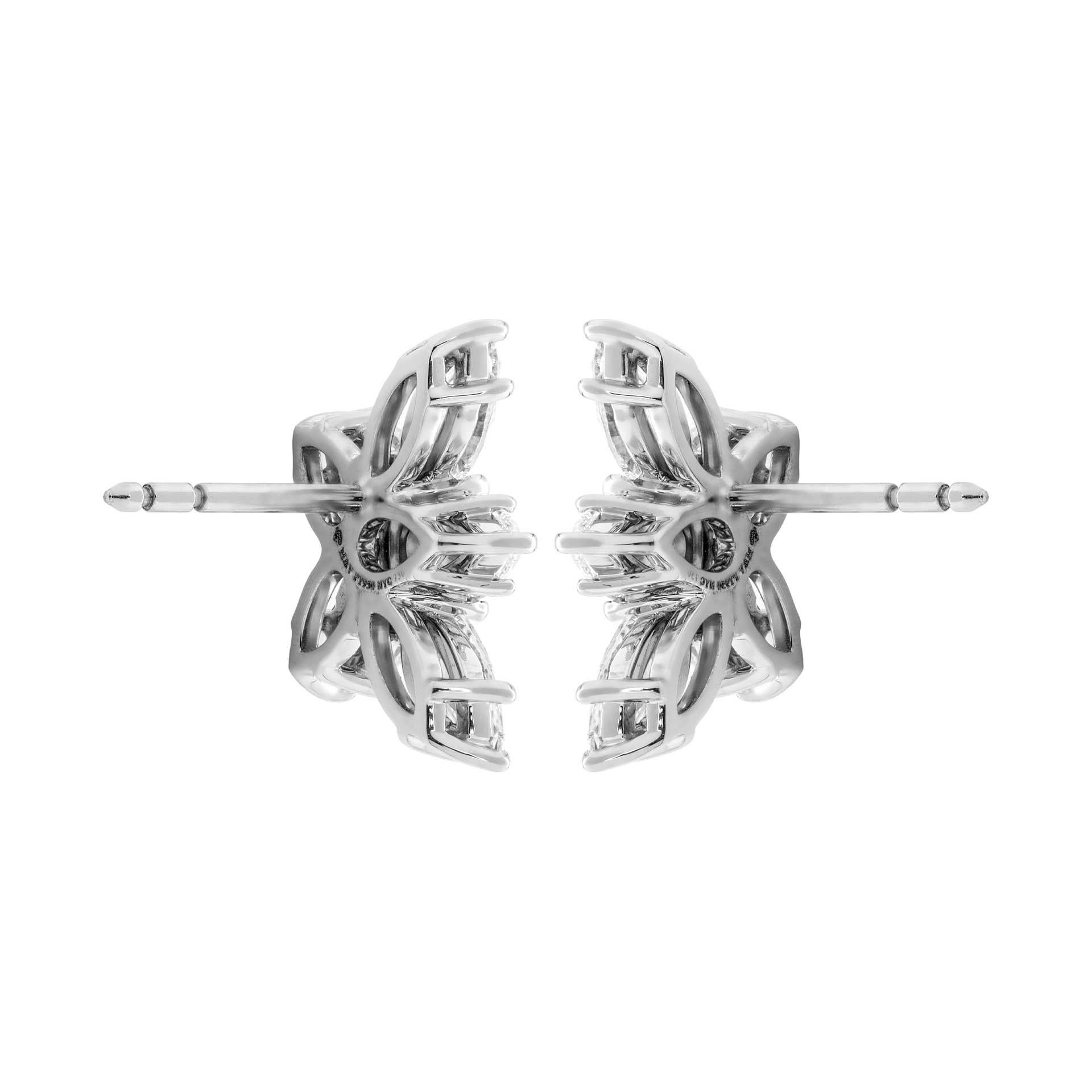 Diamond Cluster Earrings on Platinum

Beautiful and timeless piece - combining 2 fancy shapes diamonds Pears and Marquise creating cluster that won`t miss a sparkle. Sits extremely nicely on the ear.
Totaling 6 pear-shaped (2.14ct) and 4 marquise