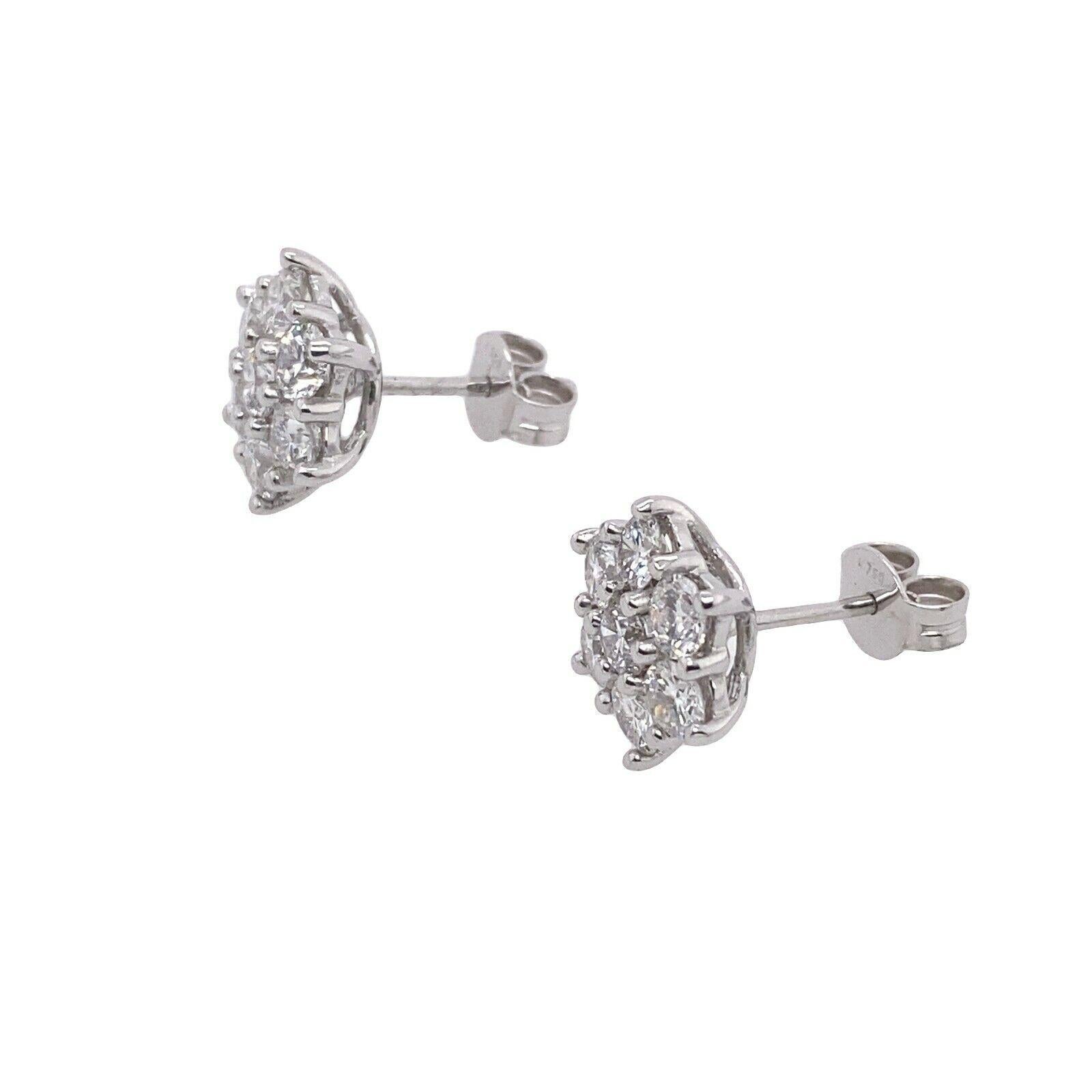 18ct White Gold Diamond Cluster Earrings Set with 1.50ct G VS of Total Diamonds with Peg & Butterfly Fittings.

Additional Information:
Total Diamond Weight: 1.50ct 
Diamond Colour: G
Diamond Clarity: VS
Total Weight: 3.8g
Earring Size: 10mm
SMS5371
