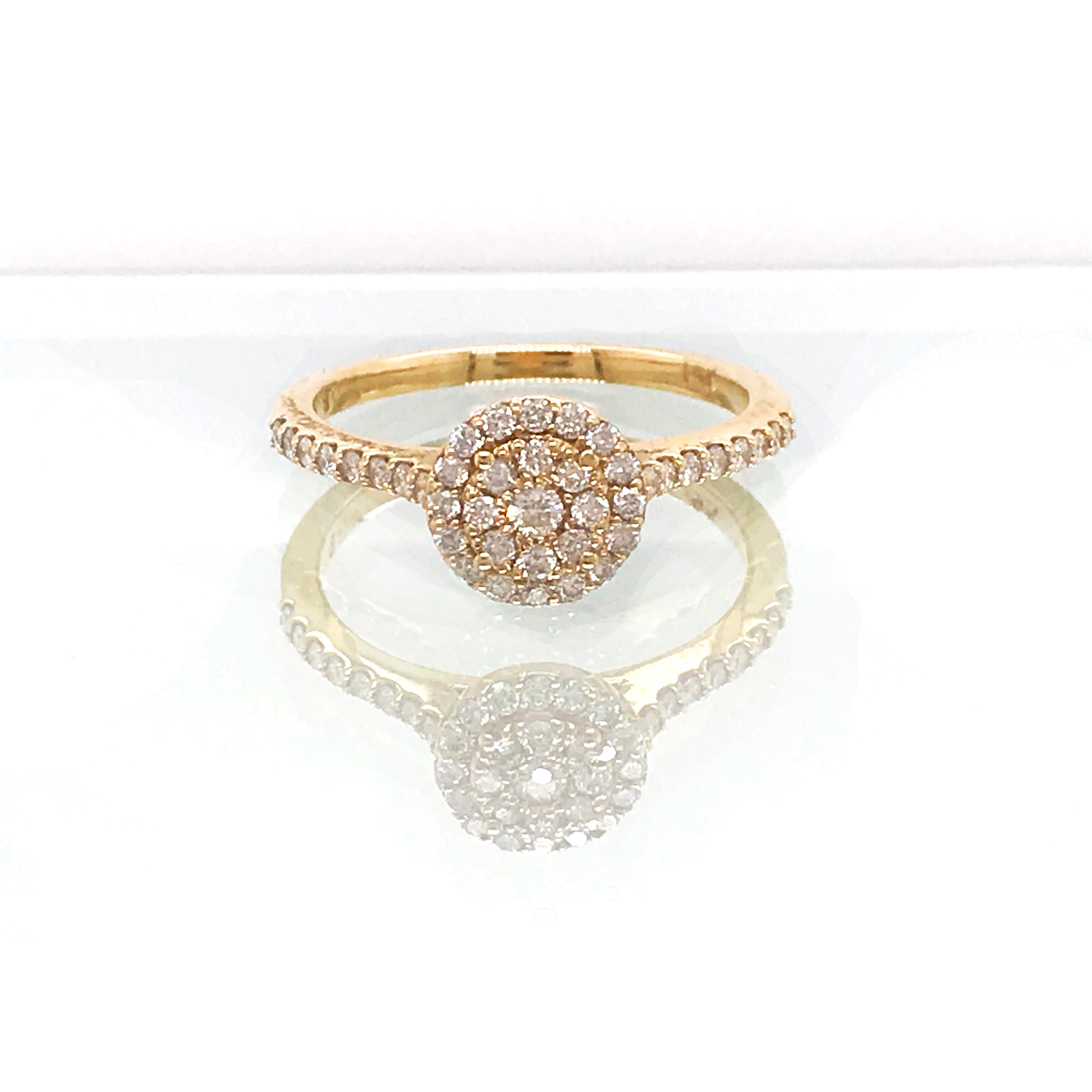 Diamond cluster ring in 14 karat yellow gold!
With 0.50 carat total diamond weight! Half a carat diamond ring! 
There is a lovely diamond cluster top with diamonds going half way around the band! This ring sparkles from every angle! 
This setting is