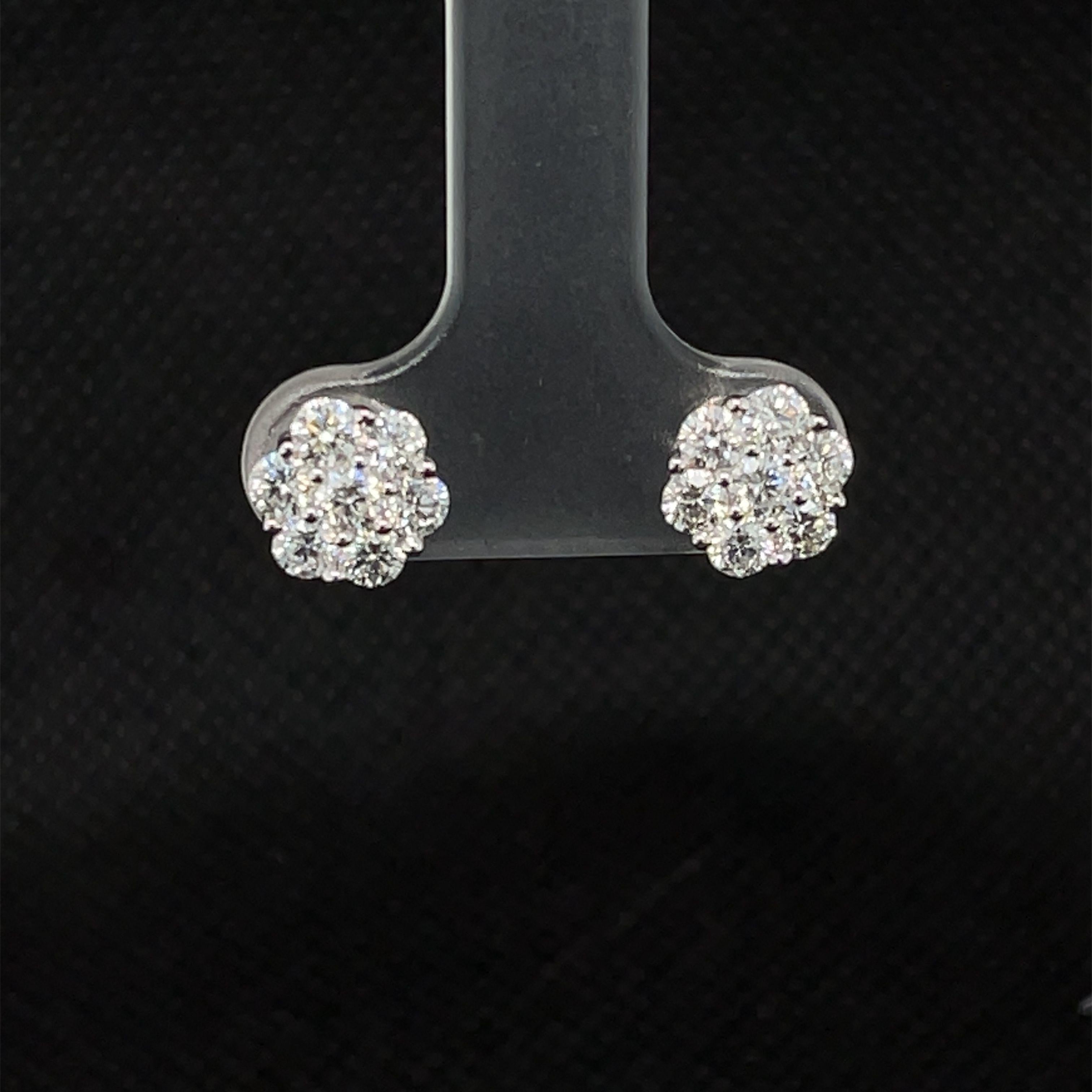 Everyone needs a pair of diamond earrings in their fine jewelry collection and these beautiful studs are a stylish and classic choice! Arranged in a simple yet beautiful floral design, these earrings were made for special occasions, like everyday