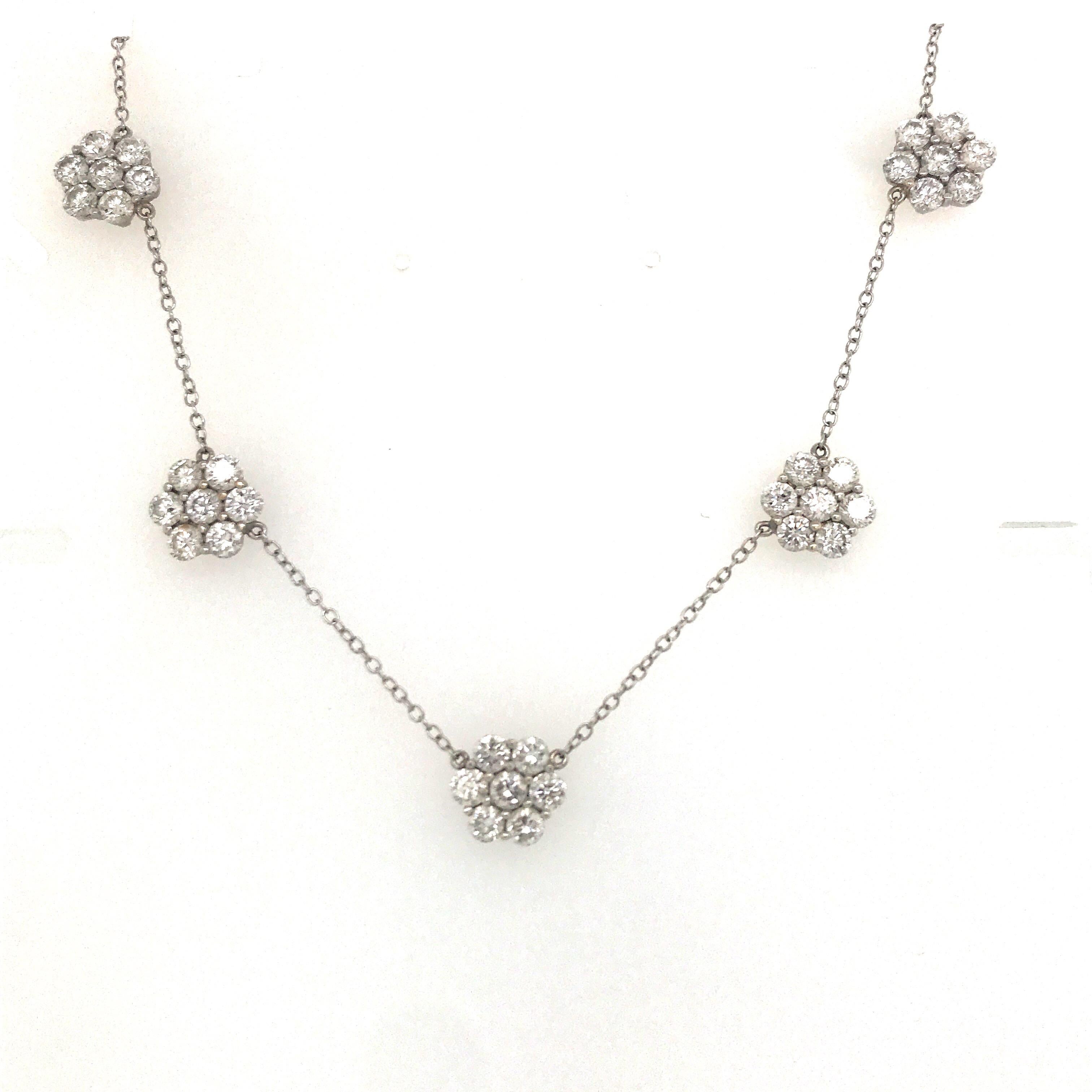 18K White gold necklace featuring 5 round brilliant clusters weighing 5.25 carats, average stone 0.15 carats.

Available in single pendant, or three floral pendant.

Customize your very own. Email Harbor Diamonds for quote.
