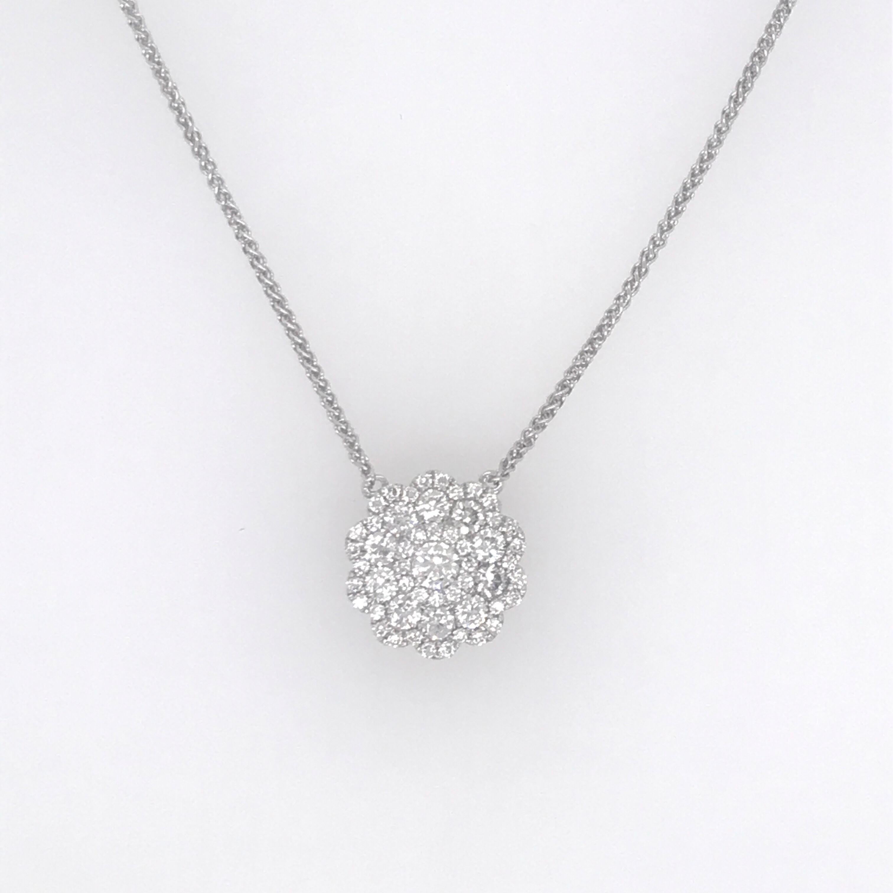 18K White gold pendant necklace featuring a floral motif of 53 round brilliants weighing 0.62 carats.
Color G-H
2.8 grams