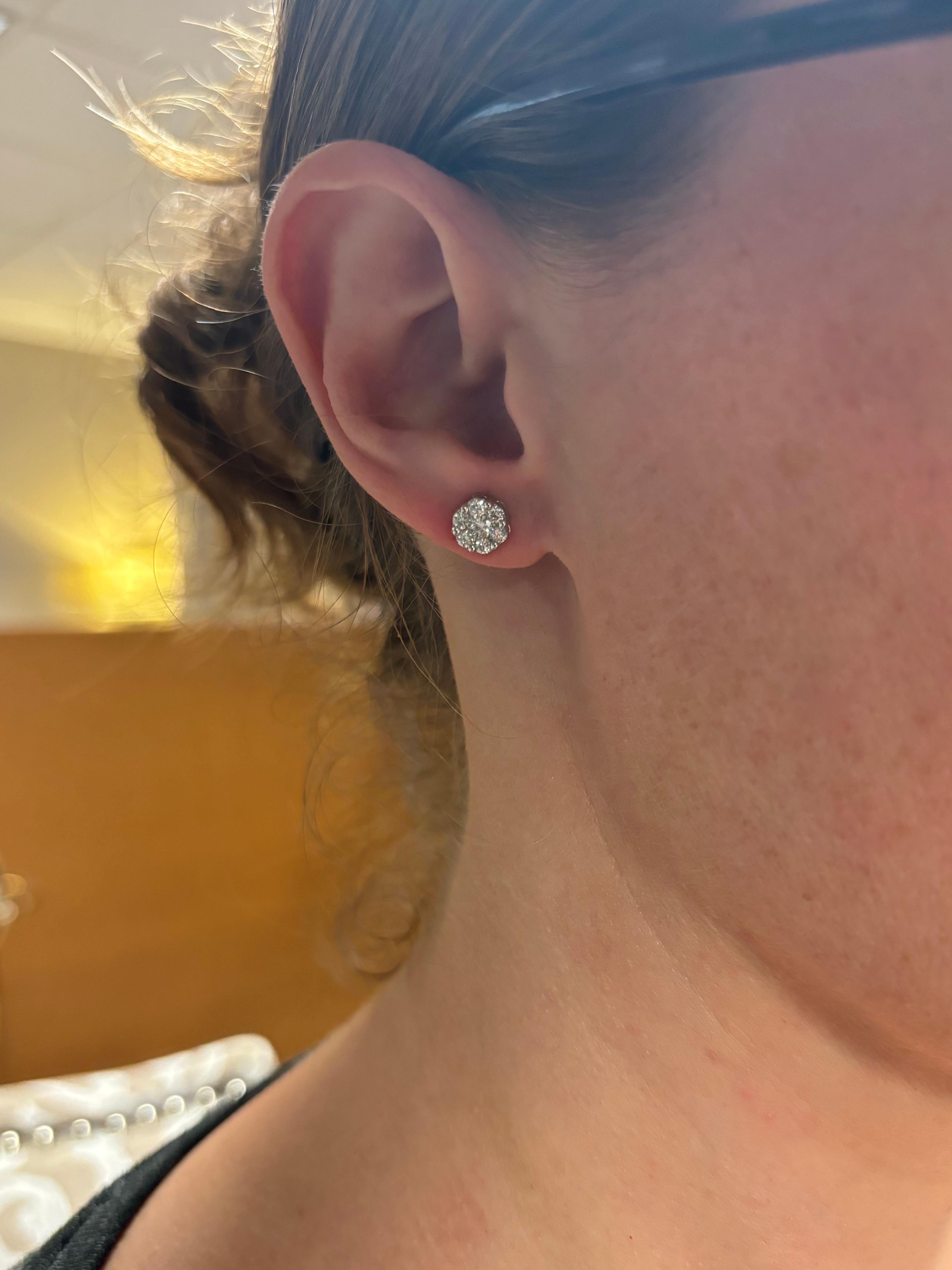Flower cluster diamond stud earrings made in 14k white gold. 

Gemstone: Earth Minded Diamonds 
Diamond Carat Weight: Approximately .65CTW 
Diamond Cut: Round Brilliant Cut 
Color: Average G-H
Clarity: Average VS-SI
Metal: 14K White 
Marked/Tested: