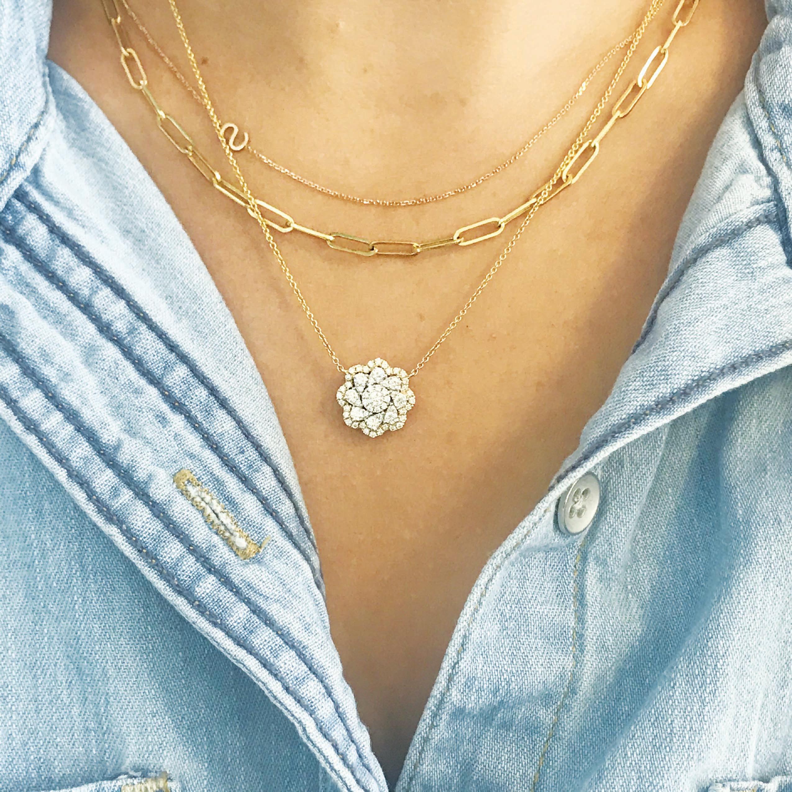 Gorgeous diamond flower pendant and chain! The necklace has 58 round brilliant diamonds, micro-pave set in a gorgeous floral arrangement! The 2 tone design is dynamic and classy! The necklace goes with everything! Wear it on its own as a statement,