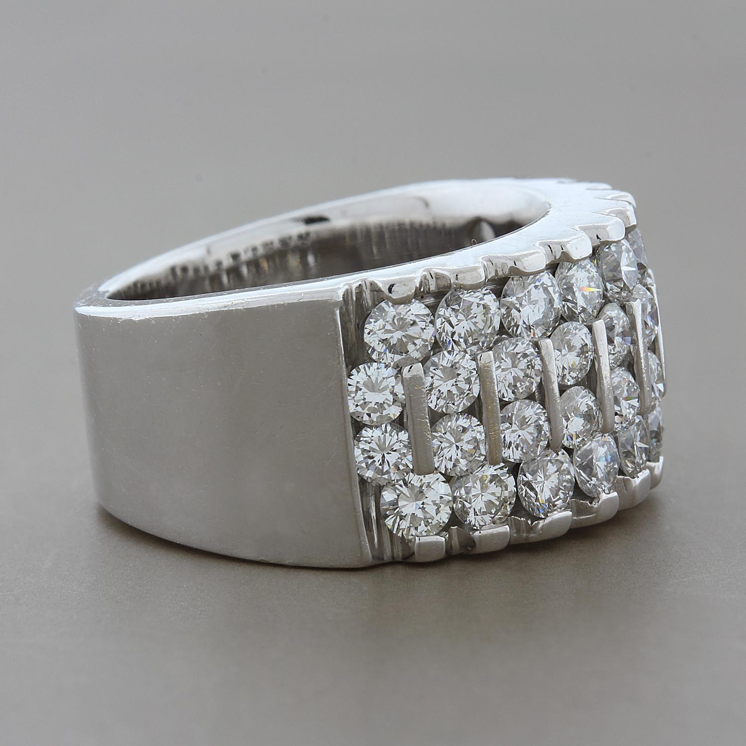 Glitz and sparkle! This band features 3.48 carats of VS quality round cut diamonds set in 18K white gold. The channel set diamonds in the center sets this band apart from the rest. Four rows of diamonds go half-circle for great comfort and allows