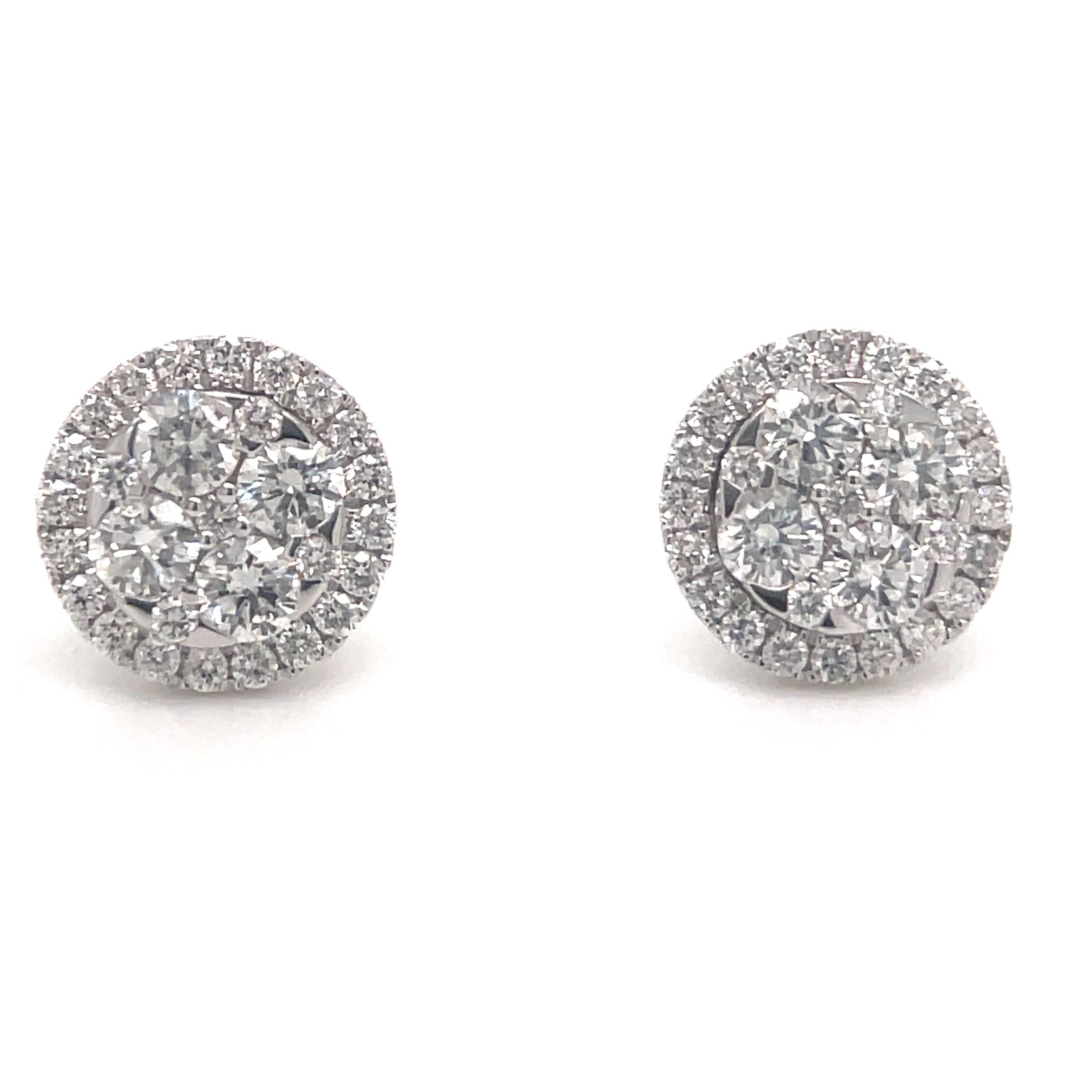 14 Karat White Gold diamond stud earrings featuring round brilliants weighing 0.58 carats and a diamond halo containing 50 diamonds weighing 0.31 carats.
Color G-H
Clarity SI